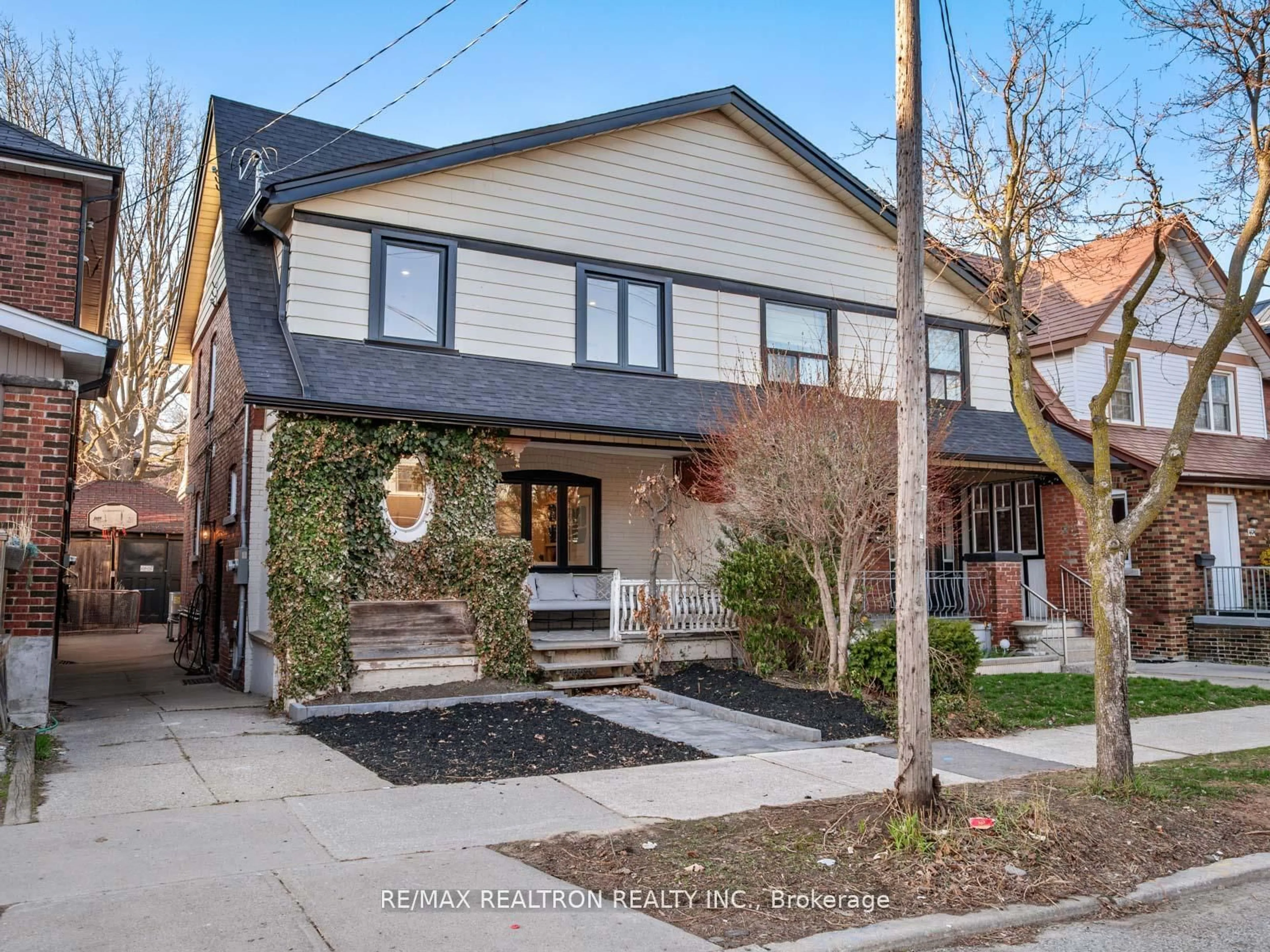Home with brick exterior material, street for 400 Strathmore Blvd, Toronto Ontario M4C 1N5