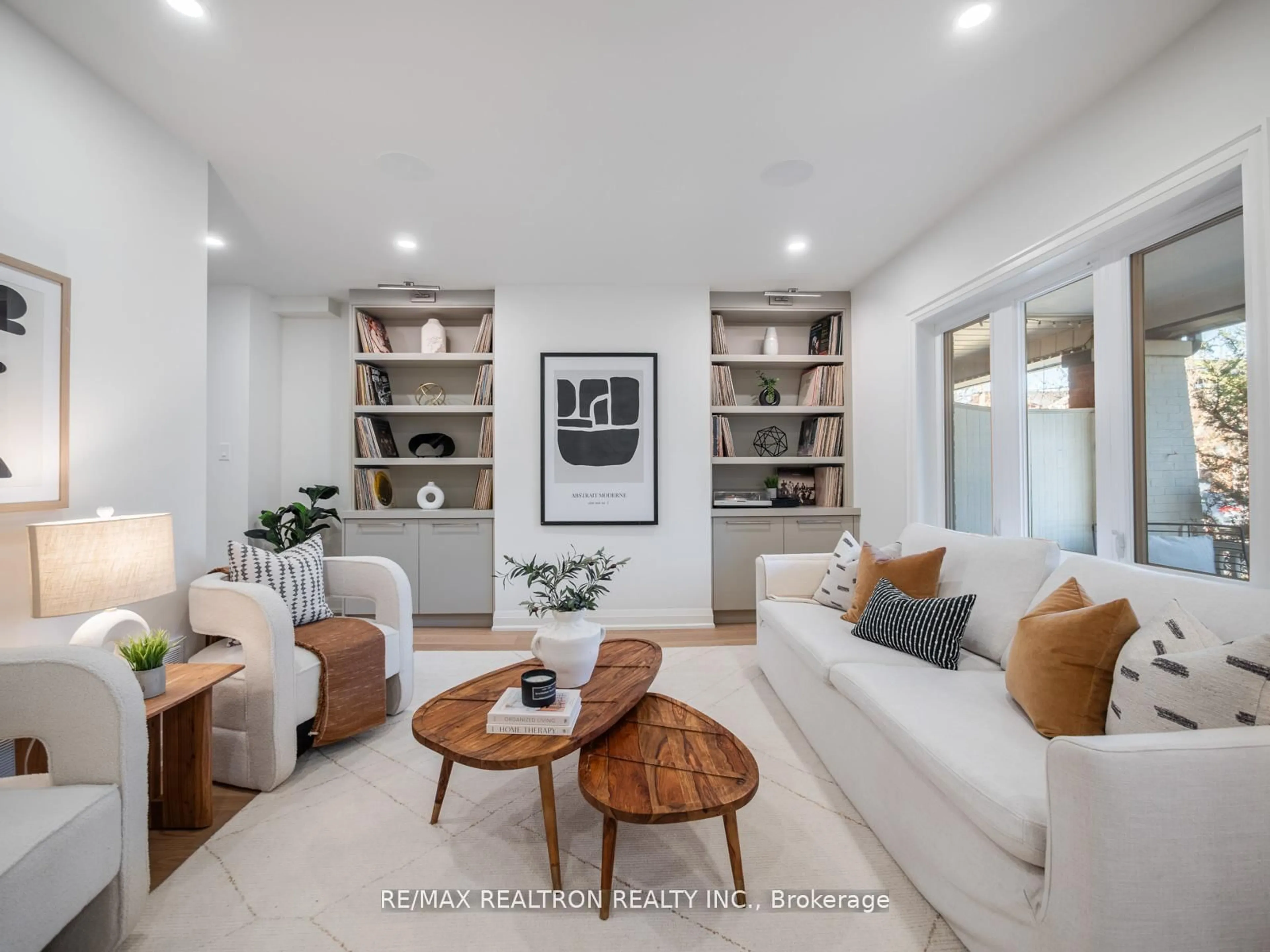 Living room with furniture, ceramic/tile floor for 400 Strathmore Blvd, Toronto Ontario M4C 1N5