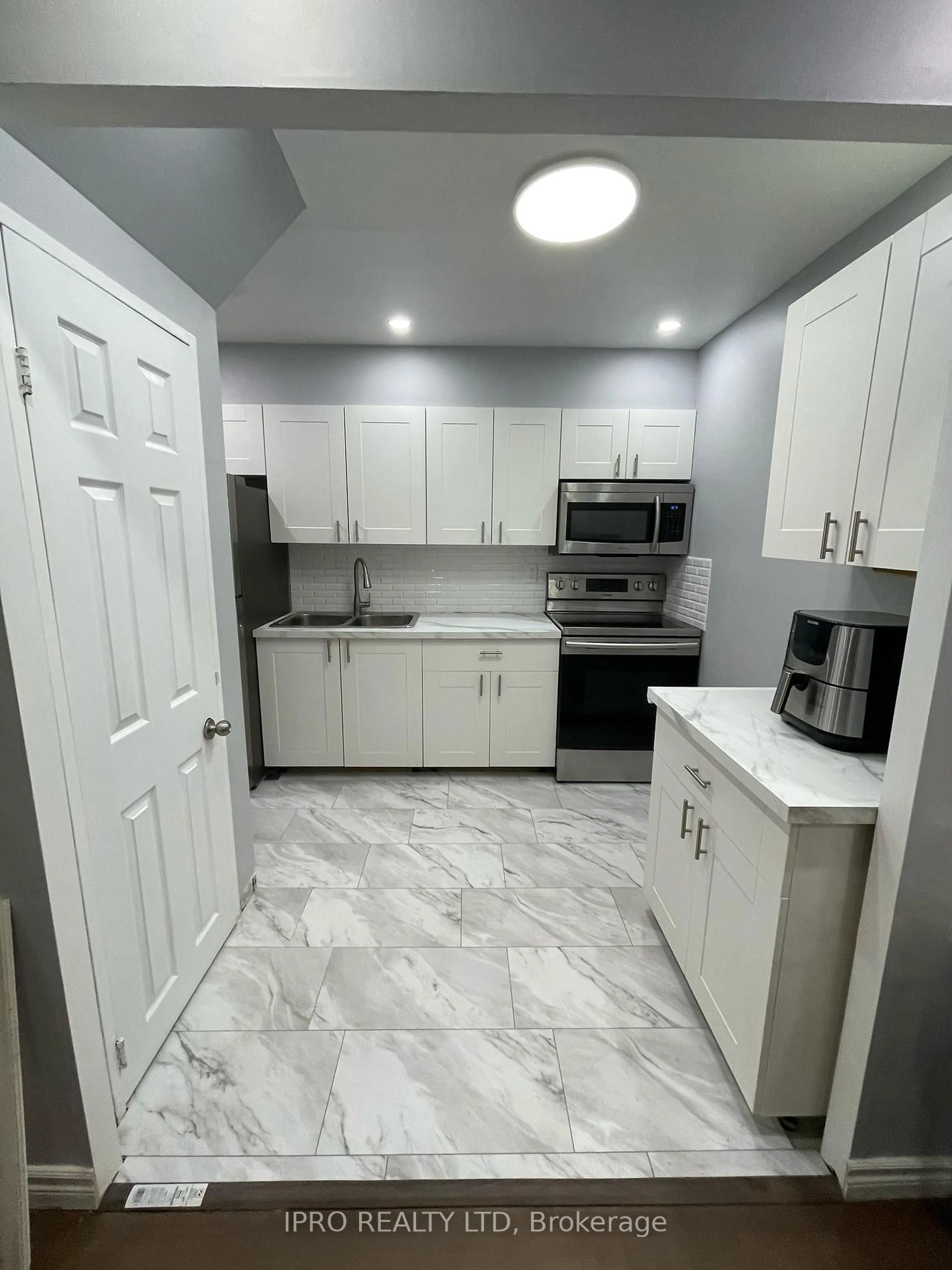 Standard kitchen, ceramic/tile floor for 100 Mornelle Crt #1034, Toronto Ontario M1E 4X2