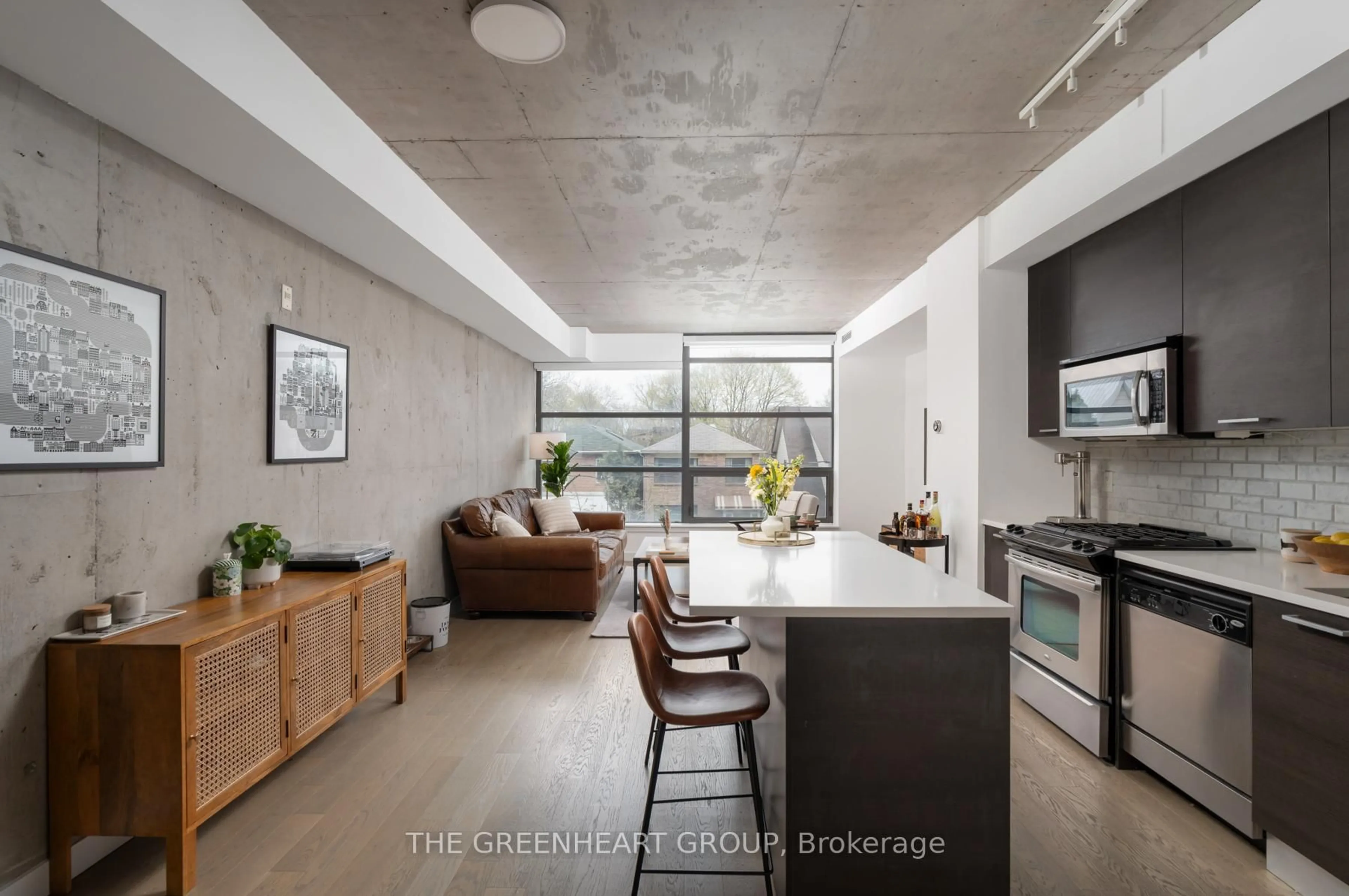 Open concept kitchen, cement floor for 90 Broadview Ave #205, Toronto Ontario M4M 0A7