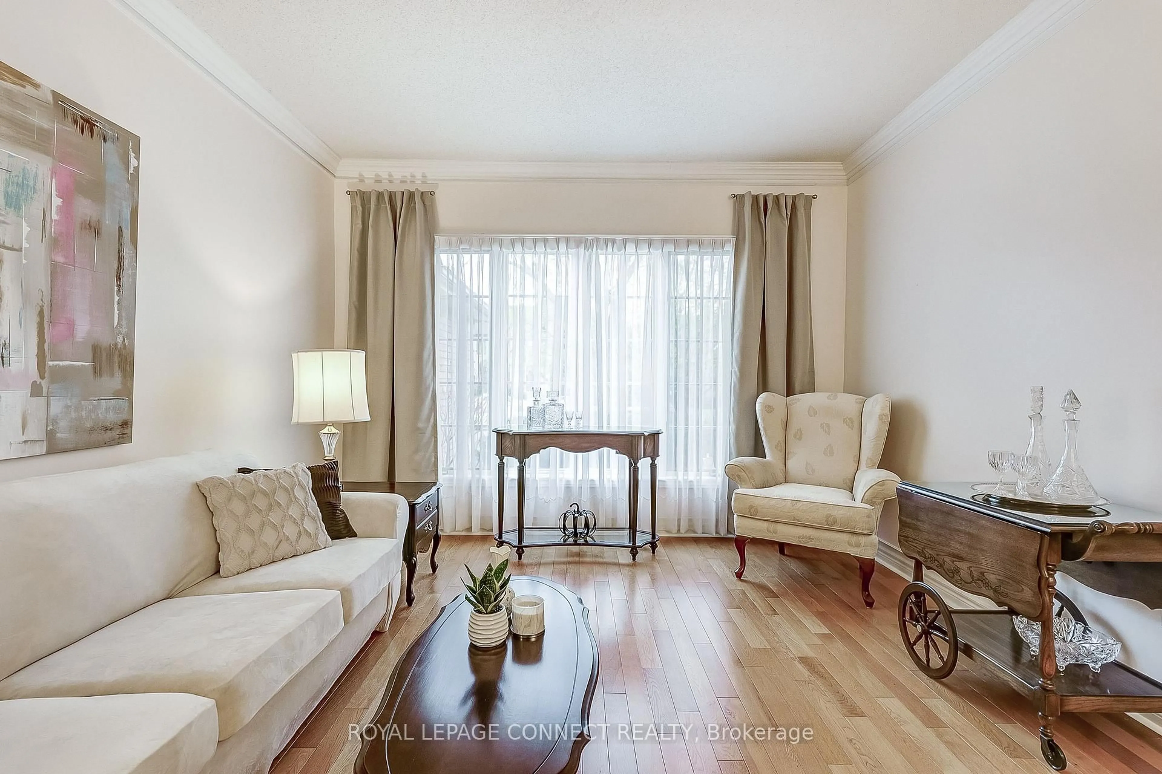 Living room with furniture, wood/laminate floor for 58 Brimwood Crt, Pickering Ontario L1V 6L1