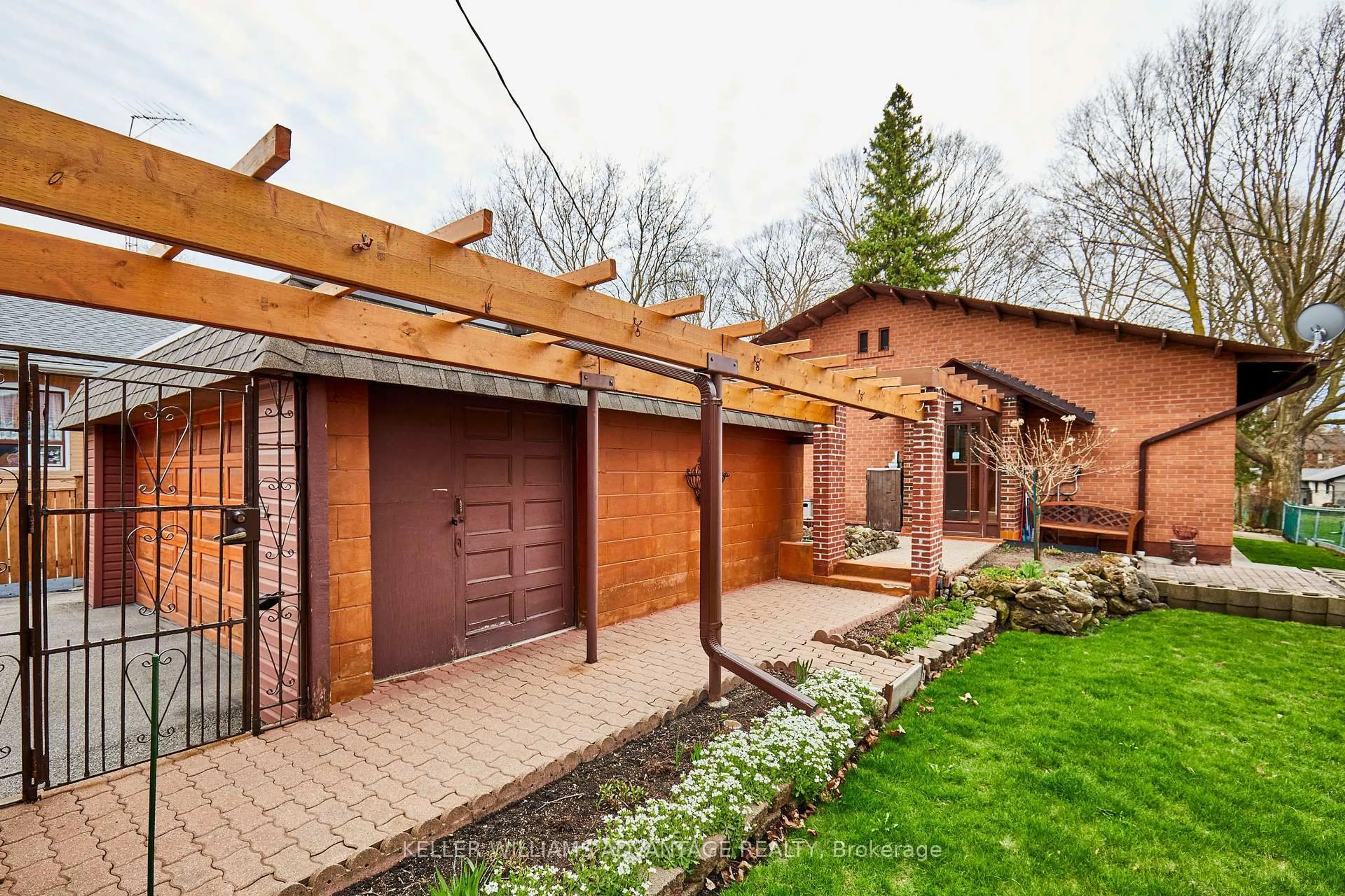 Home with brick exterior material, street for 4427 Lawrence Ave, Toronto Ontario M1E 2T6