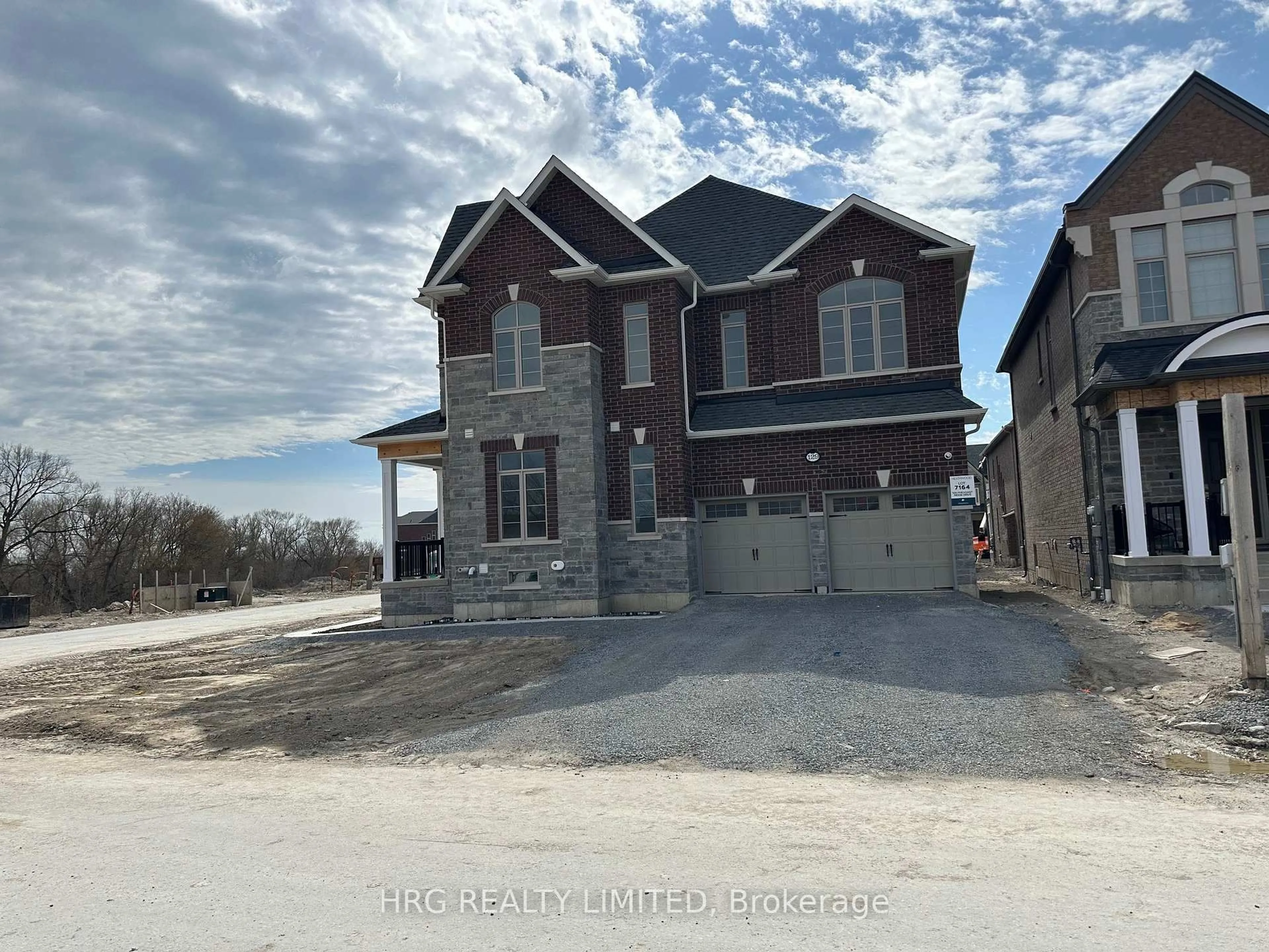 Home with brick exterior material, street for 129 Pheasant Ridge Dr, Whitby Ontario L1P 0P2