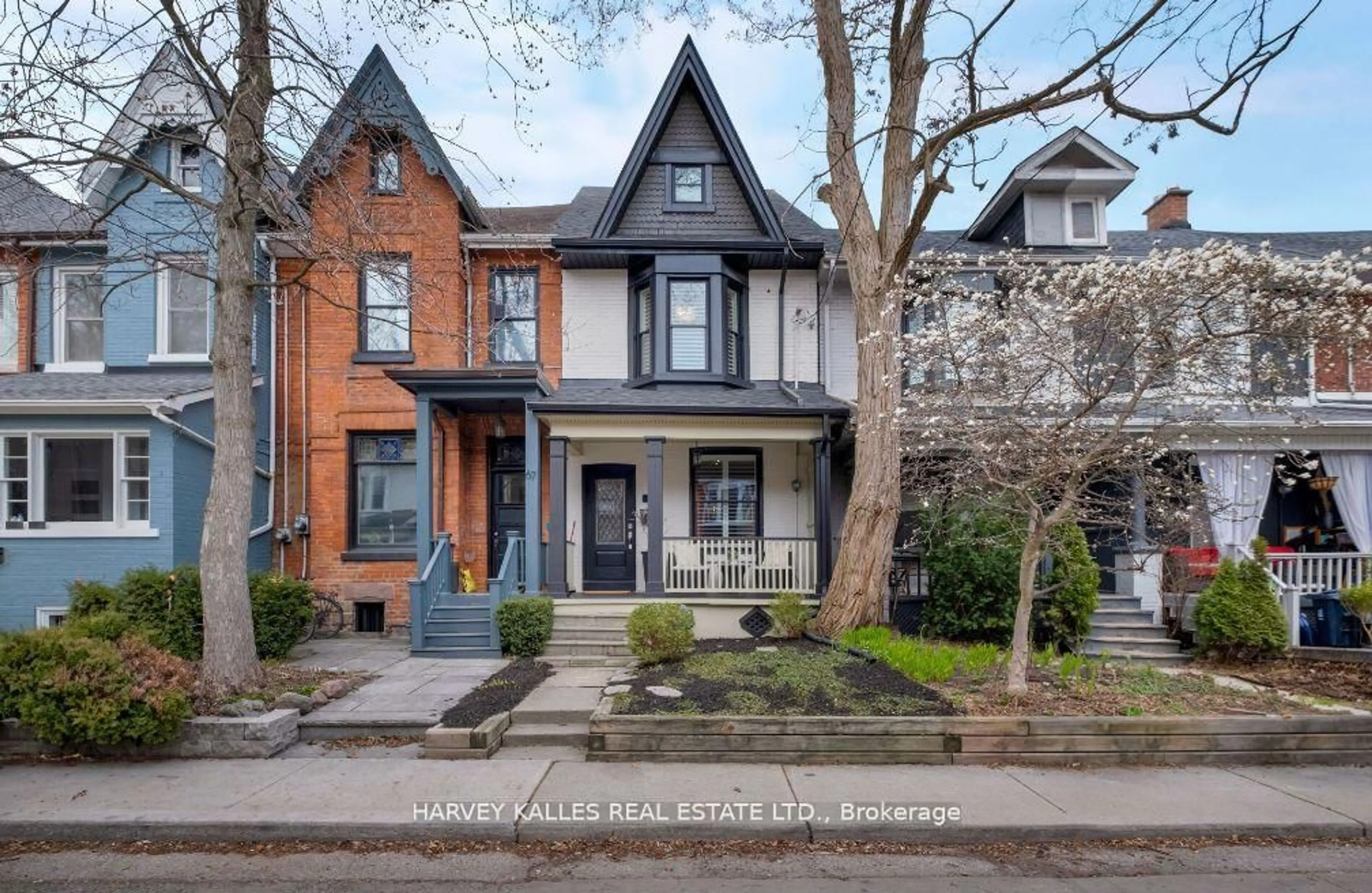 Home with brick exterior material, street for 65 Tiverton Ave, Toronto Ontario M4M 2M1