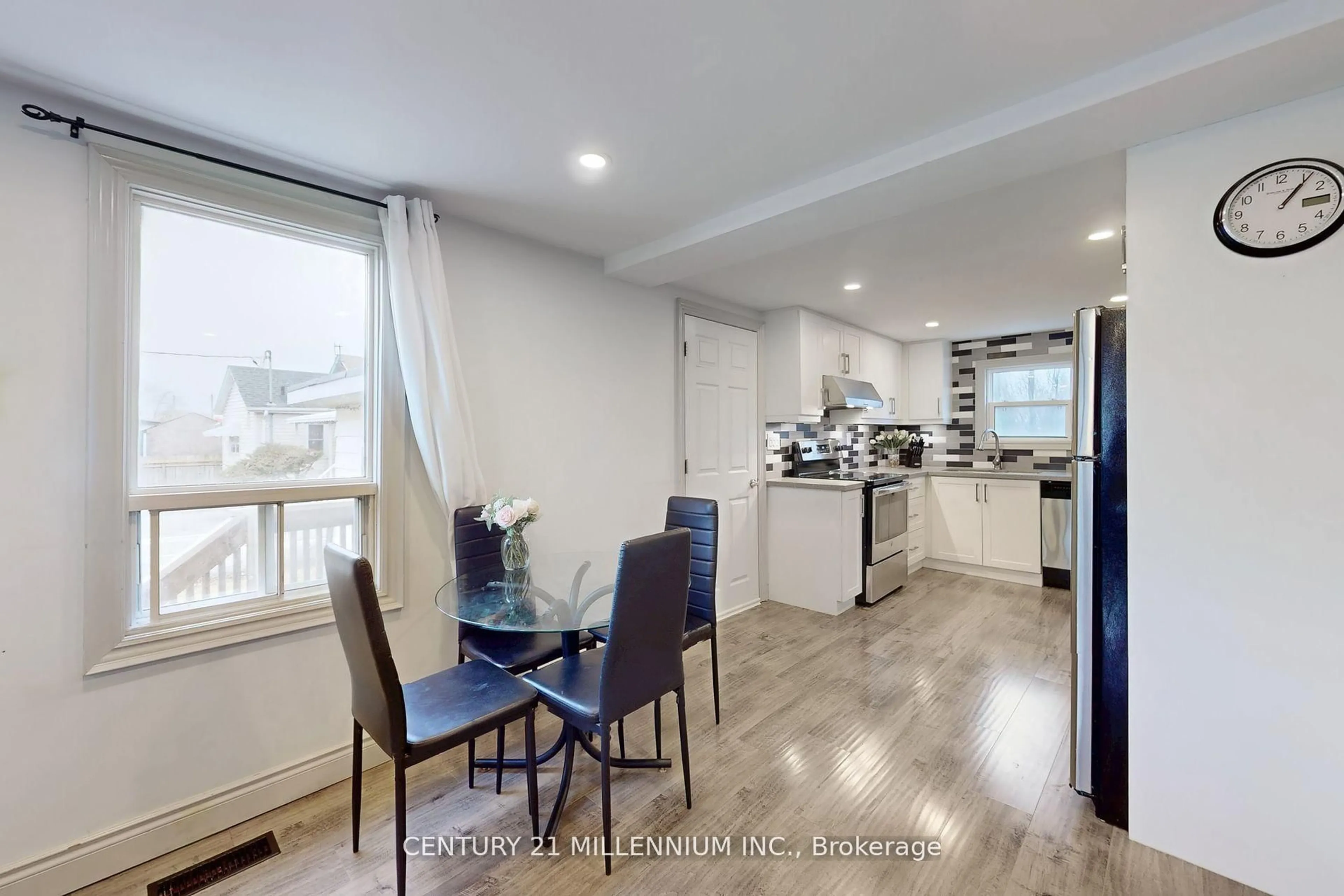 Open concept kitchen, wood/laminate floor for 142 Annis St, Oshawa Ontario L1H 3P4