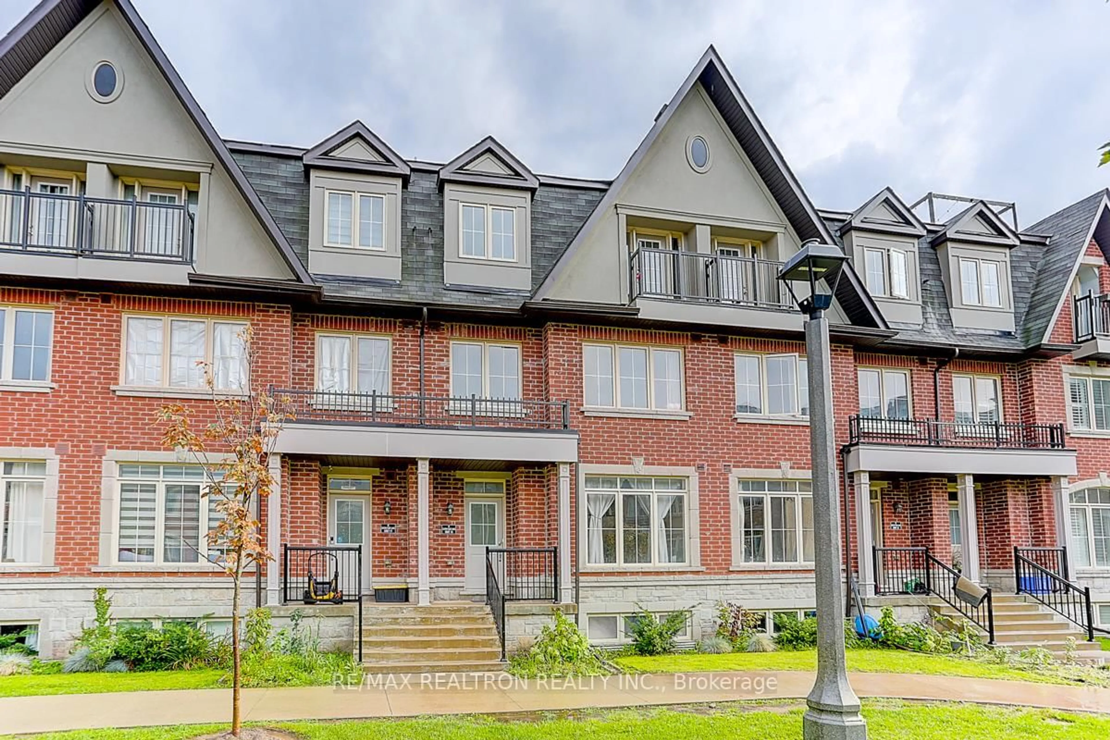 Home with brick exterior material, street for 8 Eaton Park Lane #18, Toronto Ontario M1W 0A5