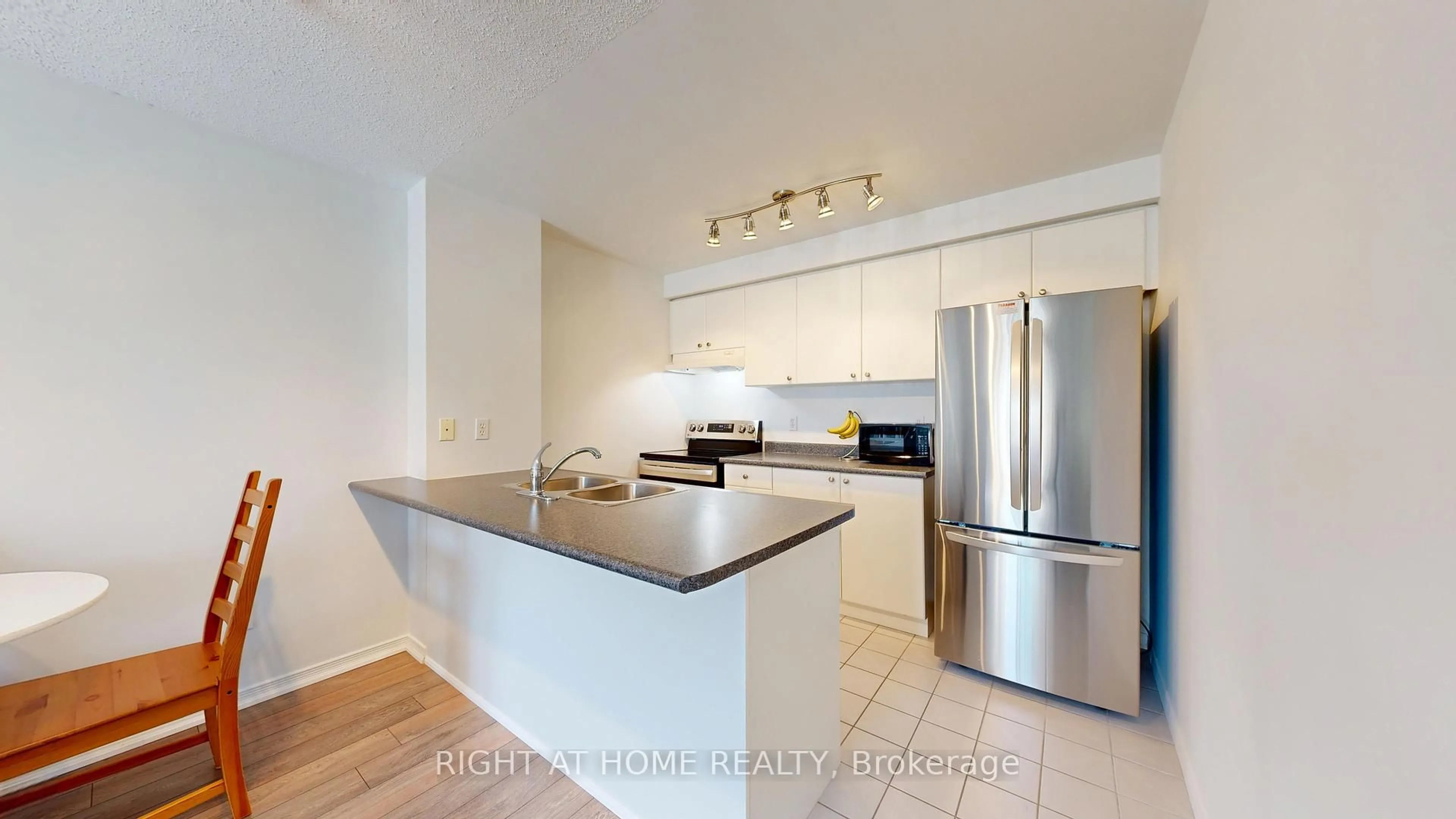 Open concept kitchen, ceramic/tile floor for 91 Aspen Springs Dr #303, Clarington Ontario L1C 5J9