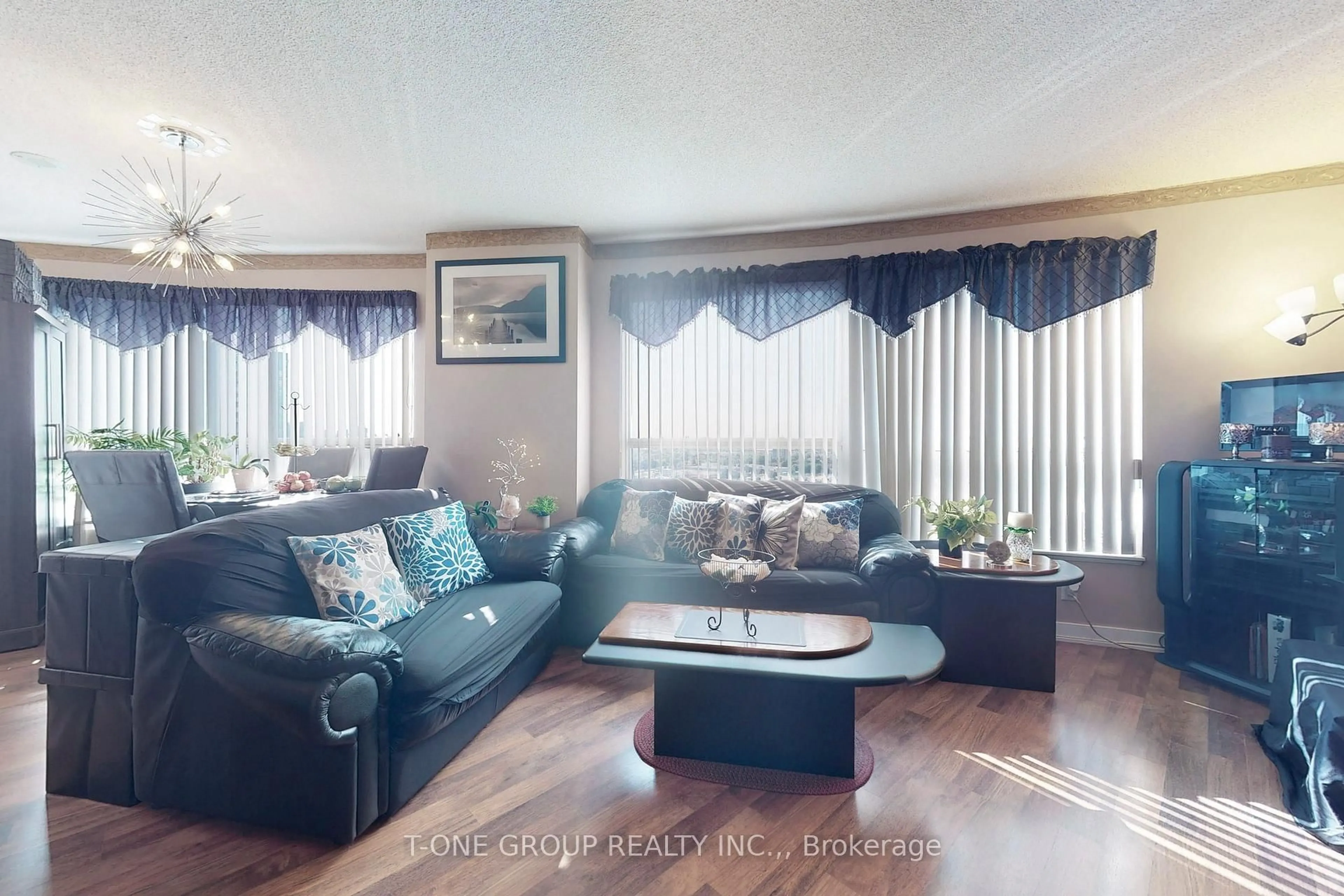 Living room with furniture, wood/laminate floor for 36 LEE CENTRE Dr #2311, Toronto Ontario M1H 3K2