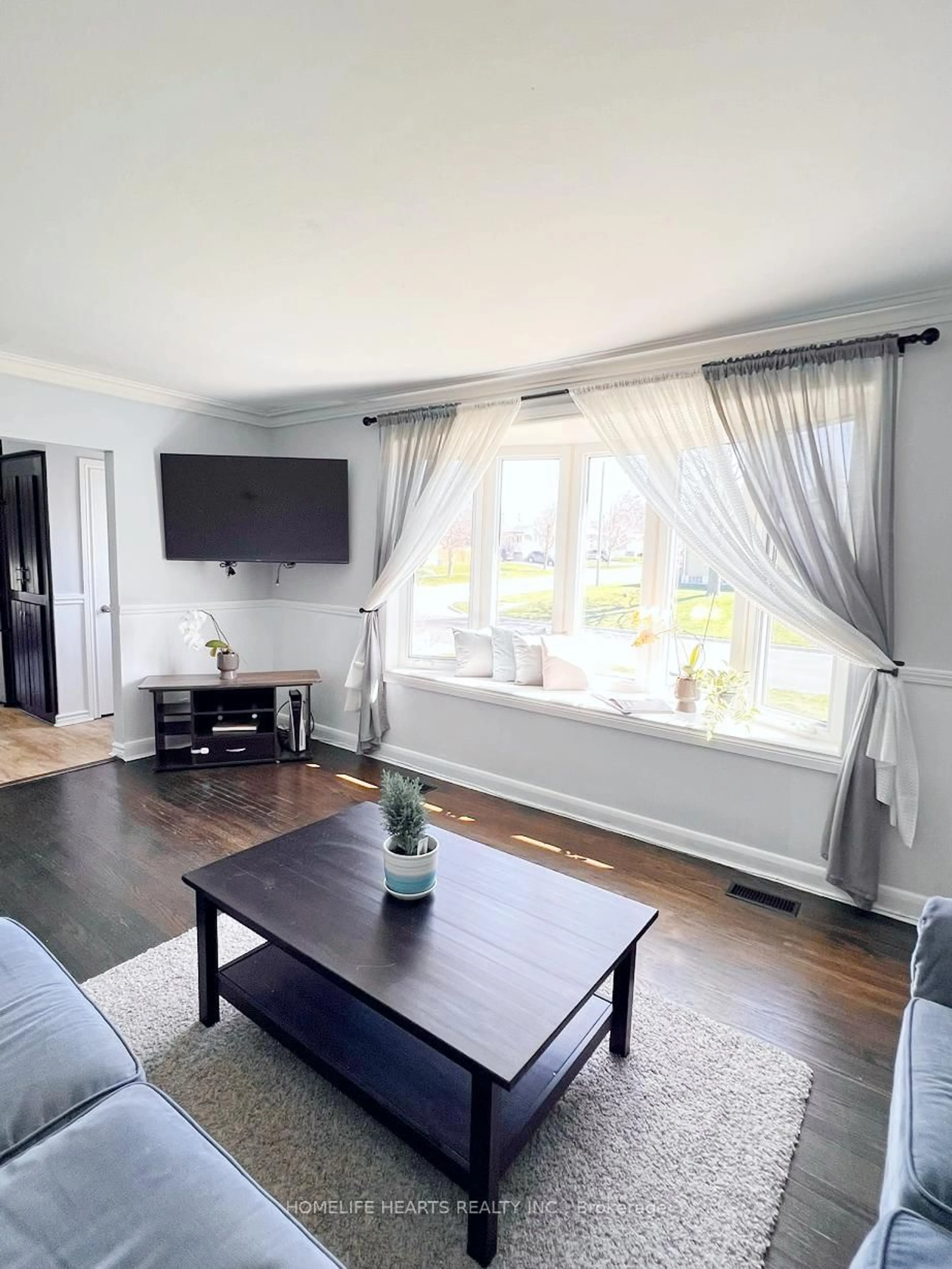 Living room with furniture, wood/laminate floor for 1442 Lakefield St, Oshawa Ontario L1J 3Z2