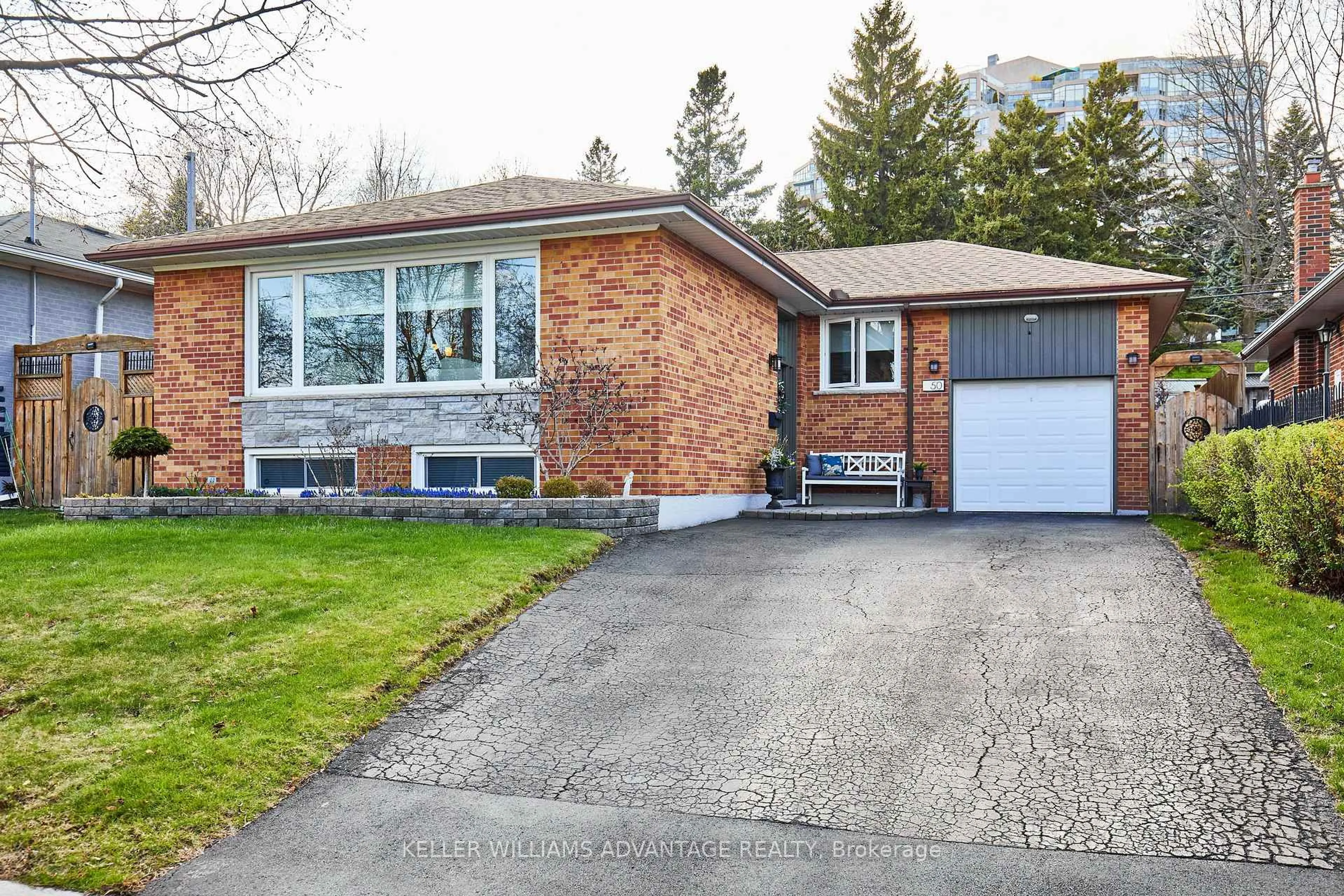 Home with brick exterior material, street for 50 Rowatson Rd, Toronto Ontario M1E 1K1