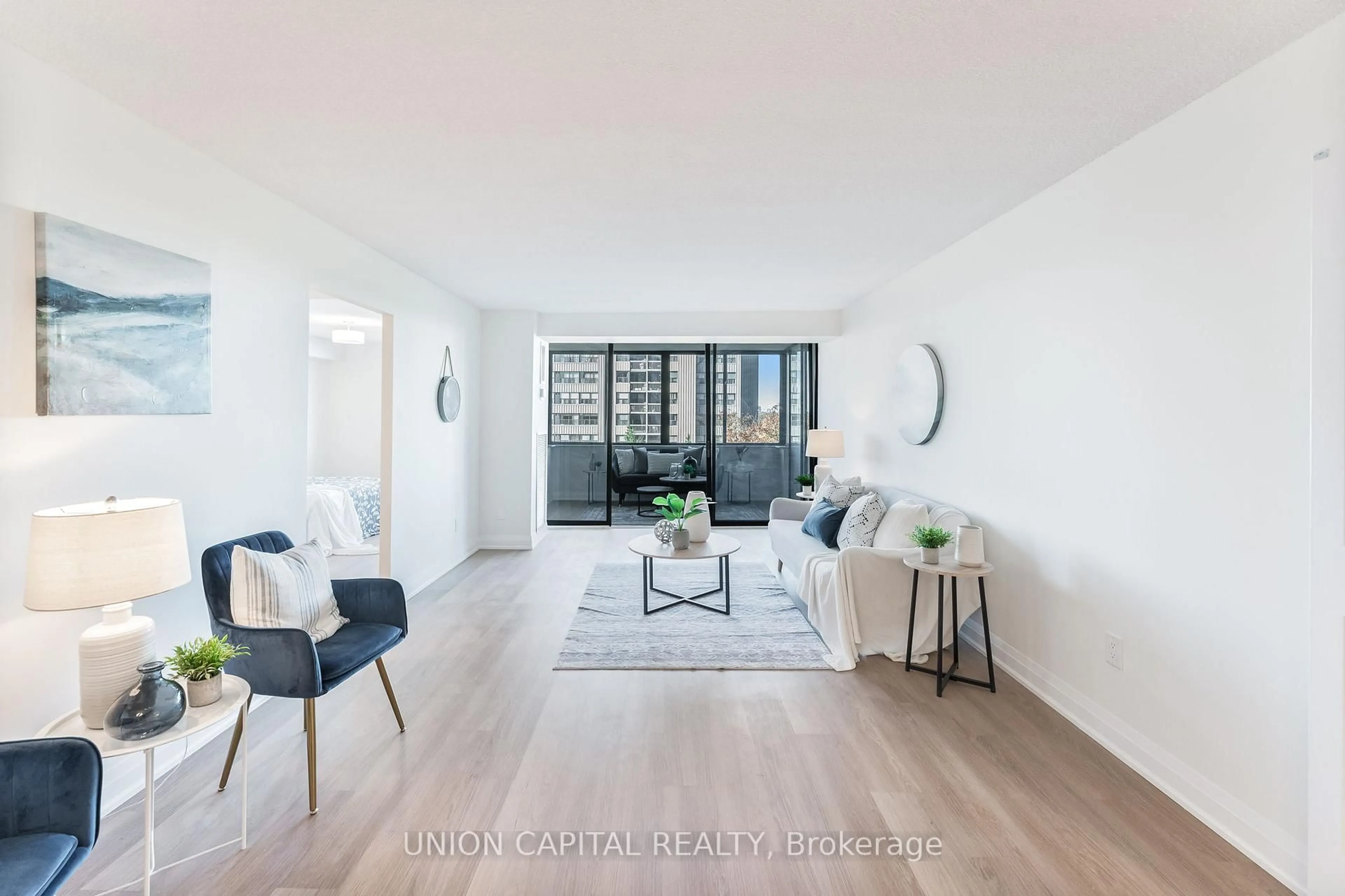 Living room with furniture, wood/laminate floor for 2350 Bridletowne Circ #611, Toronto Ontario M1W 3E6