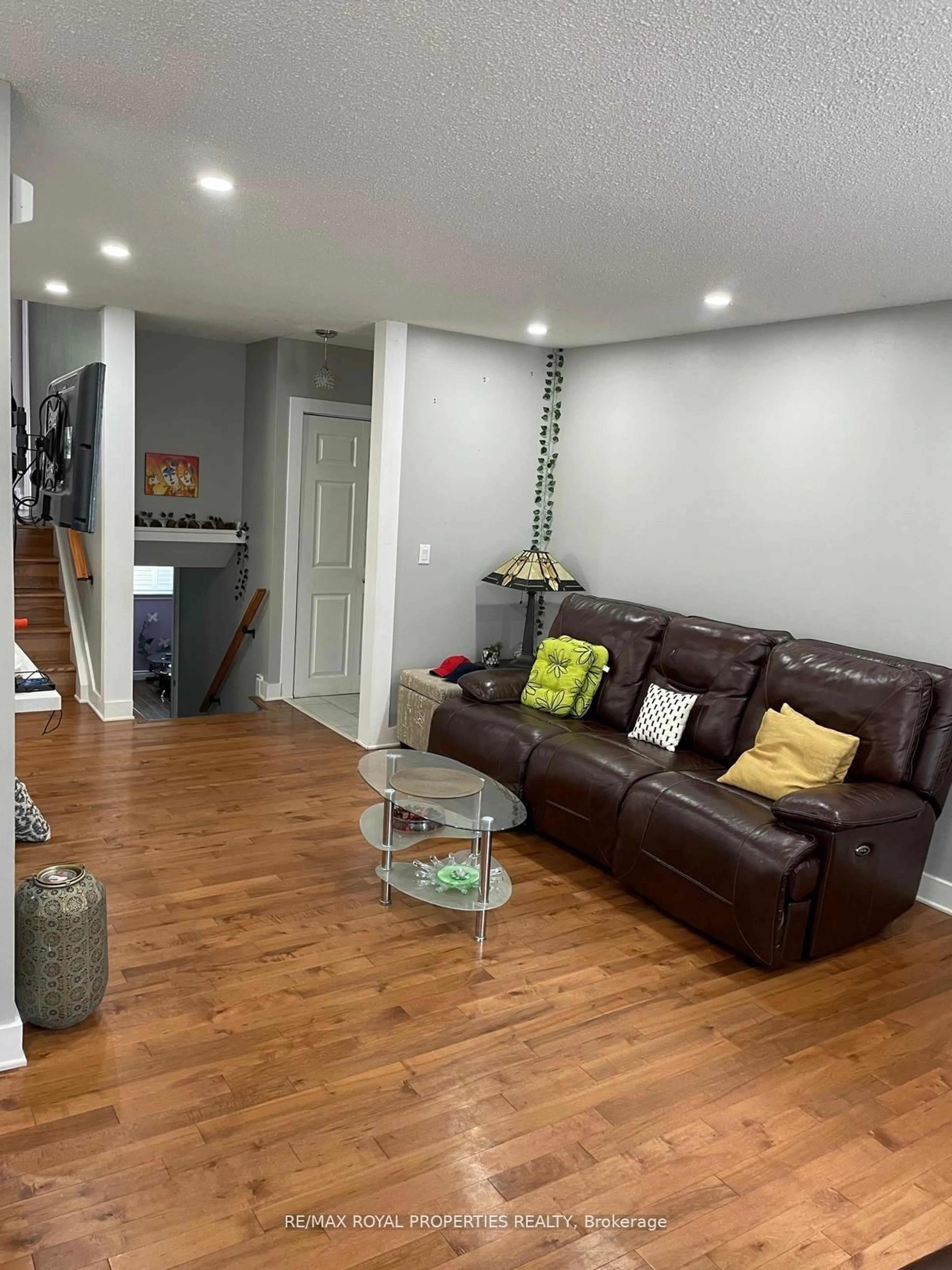 Living room with furniture, wood/laminate floor for 63 Dreyer Dr, Ajax Ontario L1S 1J3
