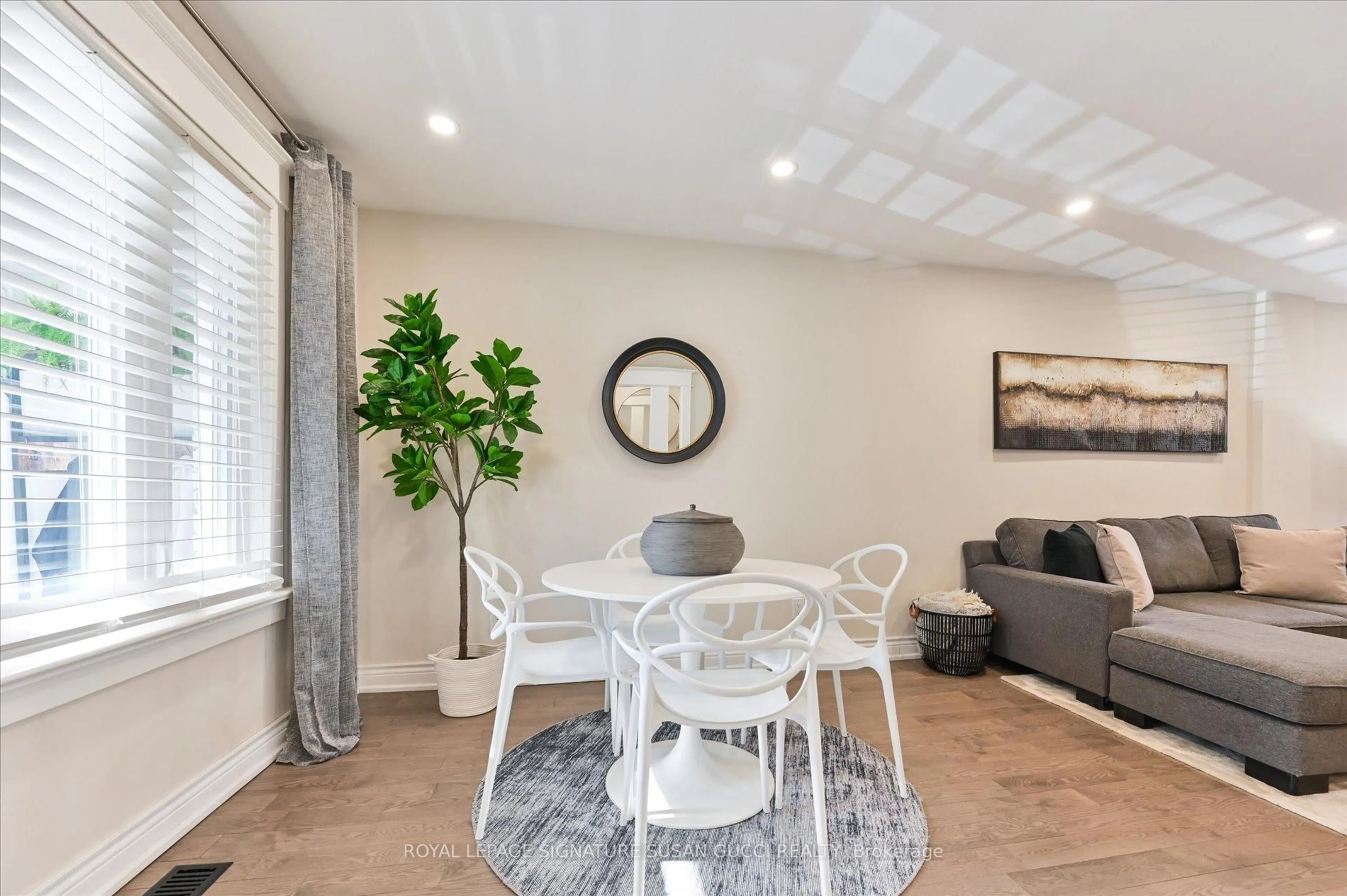 Dining room, wood/laminate floor for 1265 Woodbine Ave, Toronto Ontario M4C 4E5