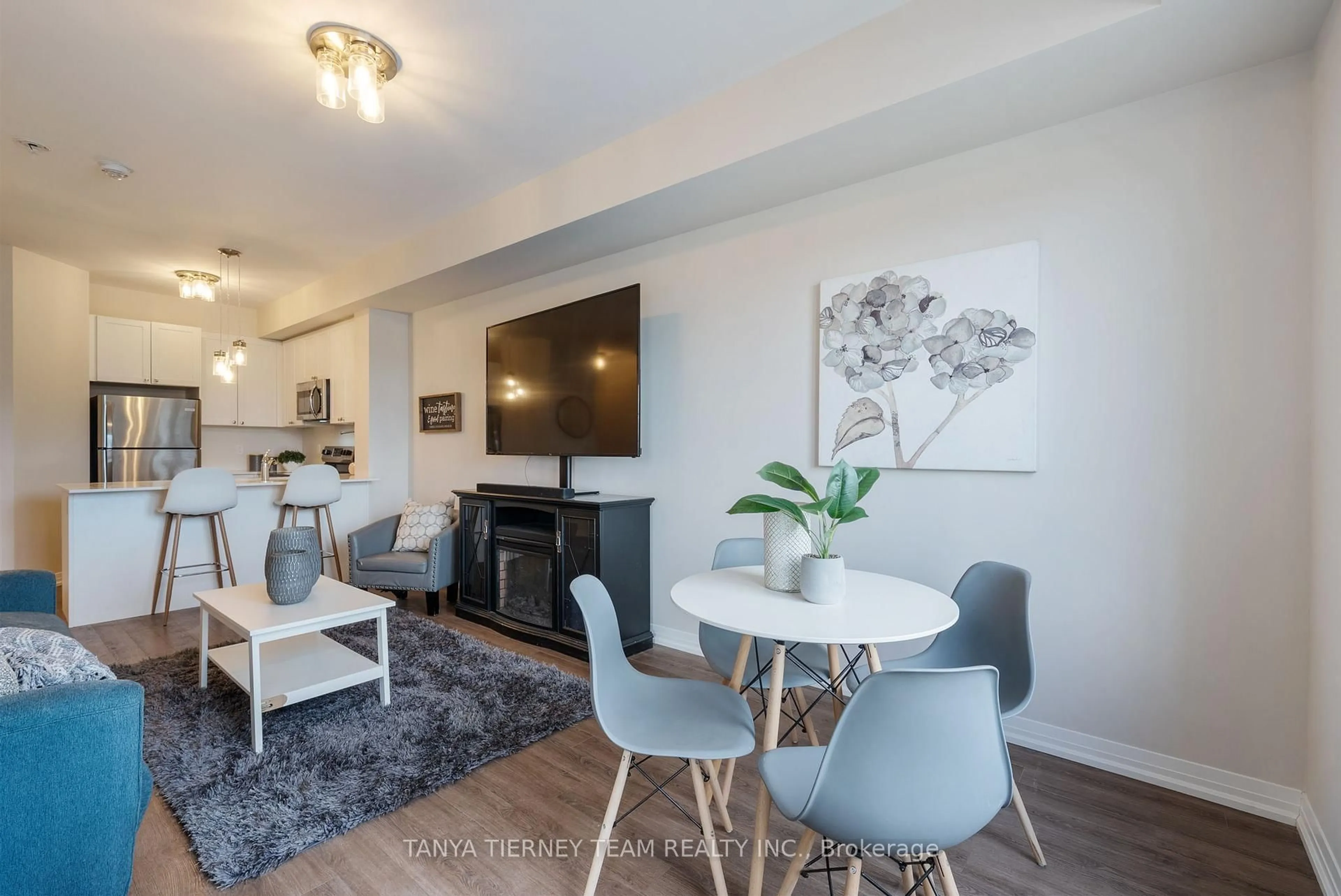 Living room with furniture, wood/laminate floor for 65 Shipway Ave #114, Clarington Ontario L1B 0B7