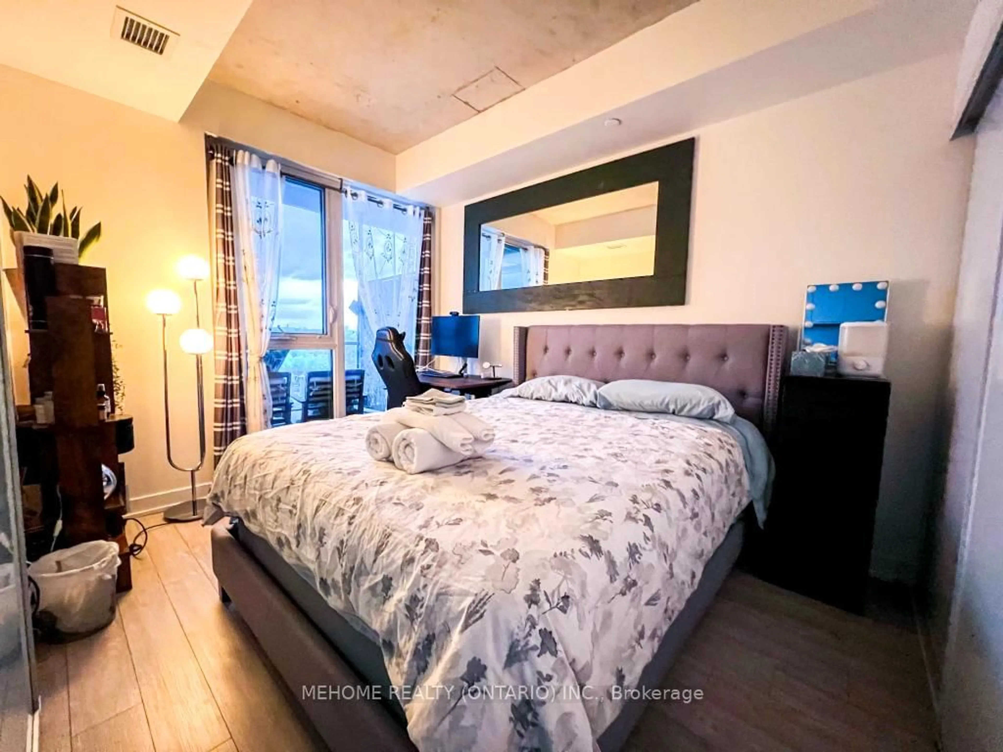 Bedroom with bed, wood/laminate floor for 30 Baseball Pl #721, Toronto Ontario M4M 0E8