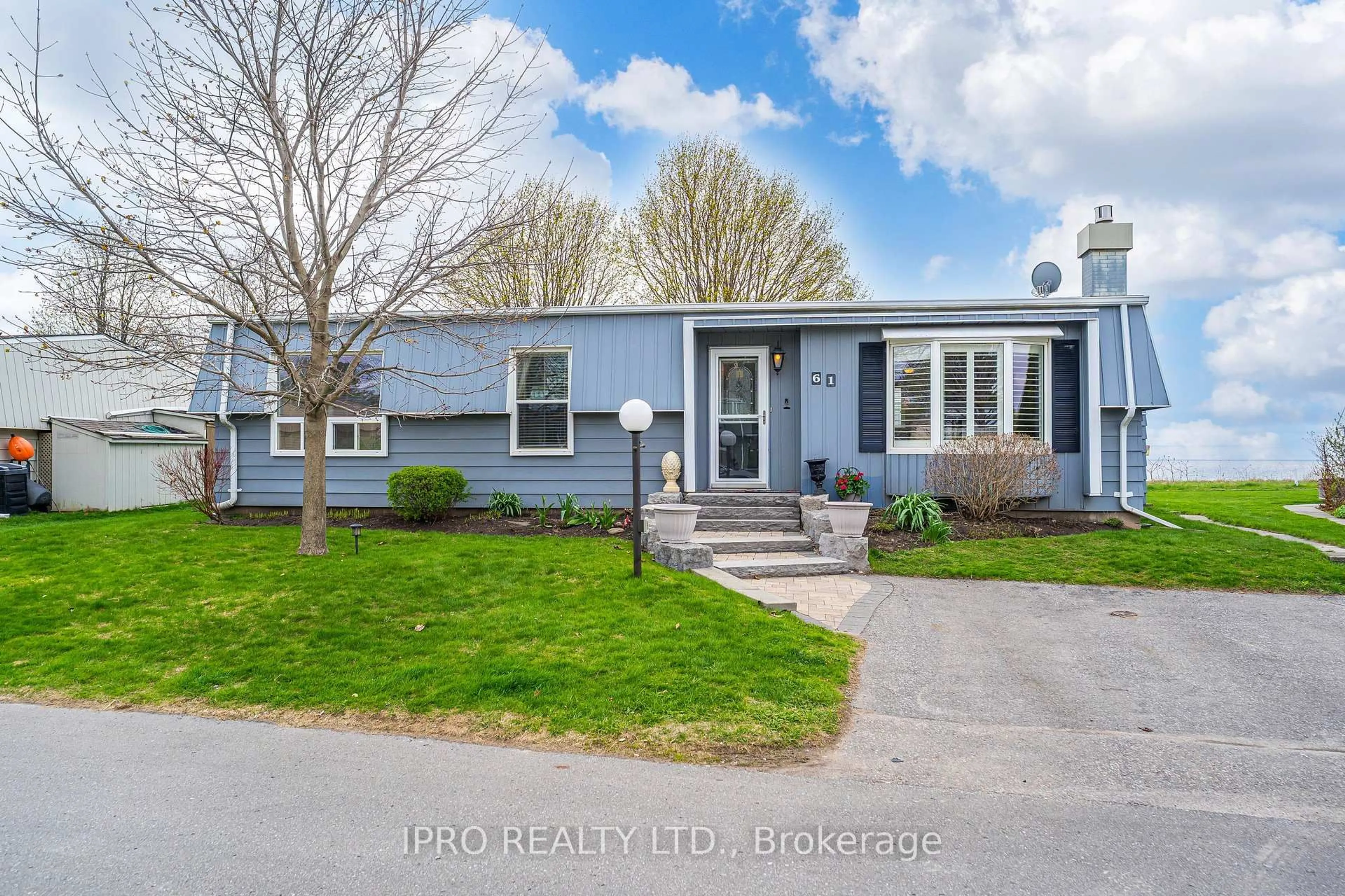 Home with vinyl exterior material, street for 61 Bluffs Rd, Clarington Ontario L1B 1A6