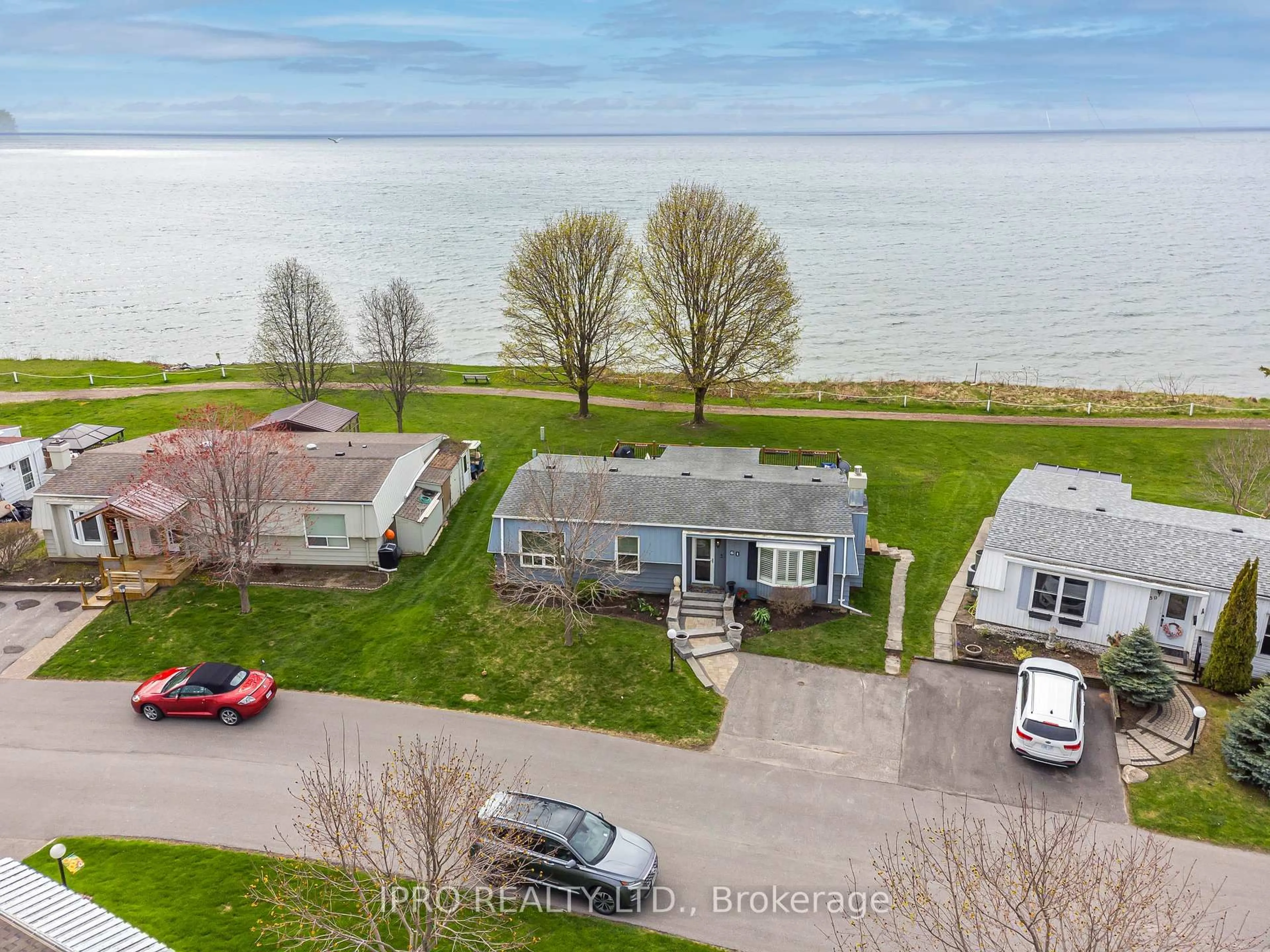 A pic from outside/outdoor area/front of a property/back of a property/a pic from drone, water/lake/river/ocean view for 61 Bluffs Rd, Clarington Ontario L1B 1A6