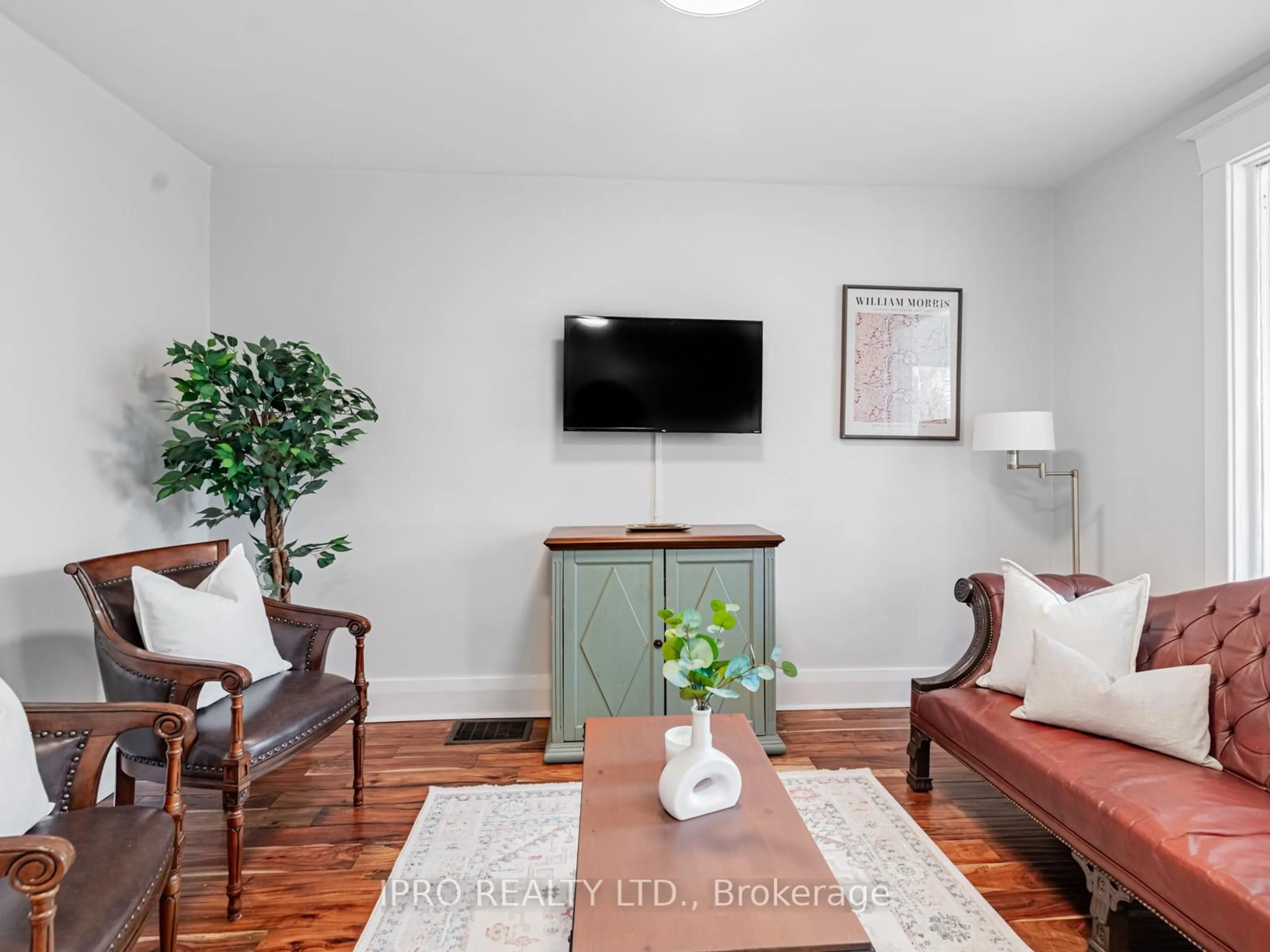 Living room with furniture, wood/laminate floor for 111 Chisholm Ave, Toronto Ontario M4C 4V6