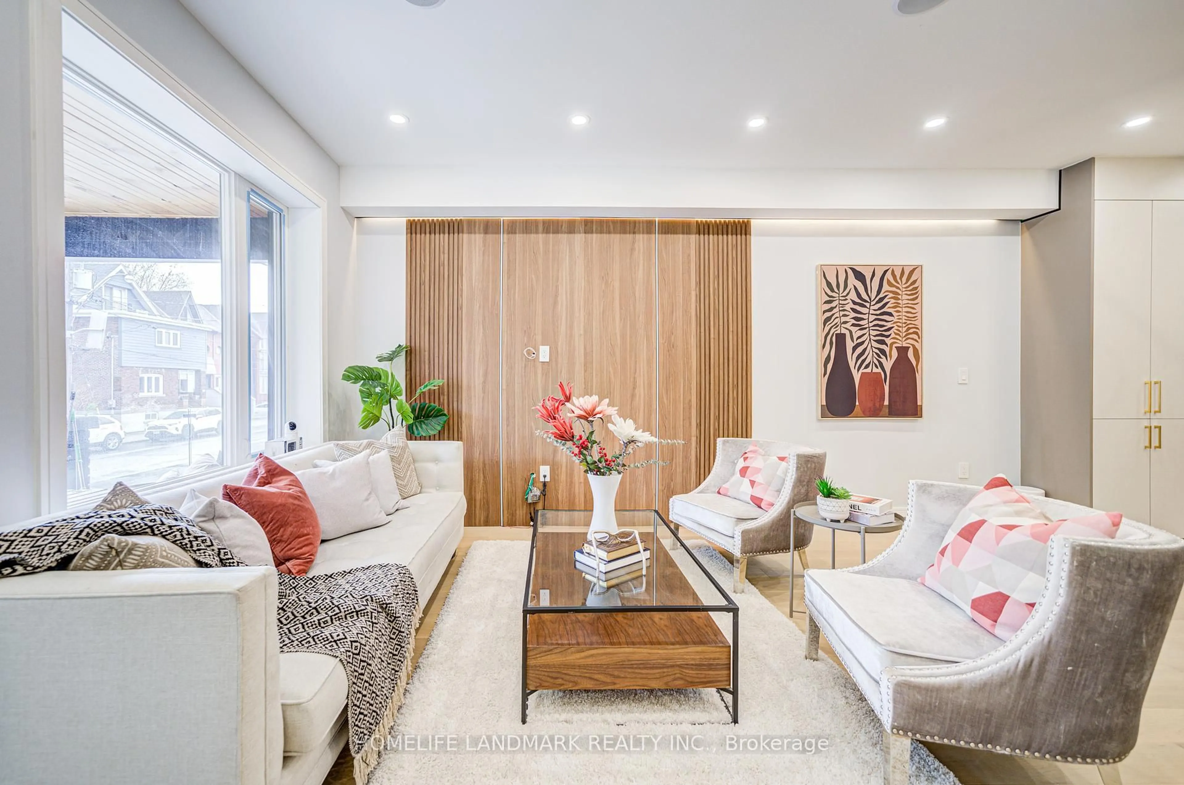 Living room with furniture, wood/laminate floor for 770 Pape Ave, Toronto Ontario M4K 3S7