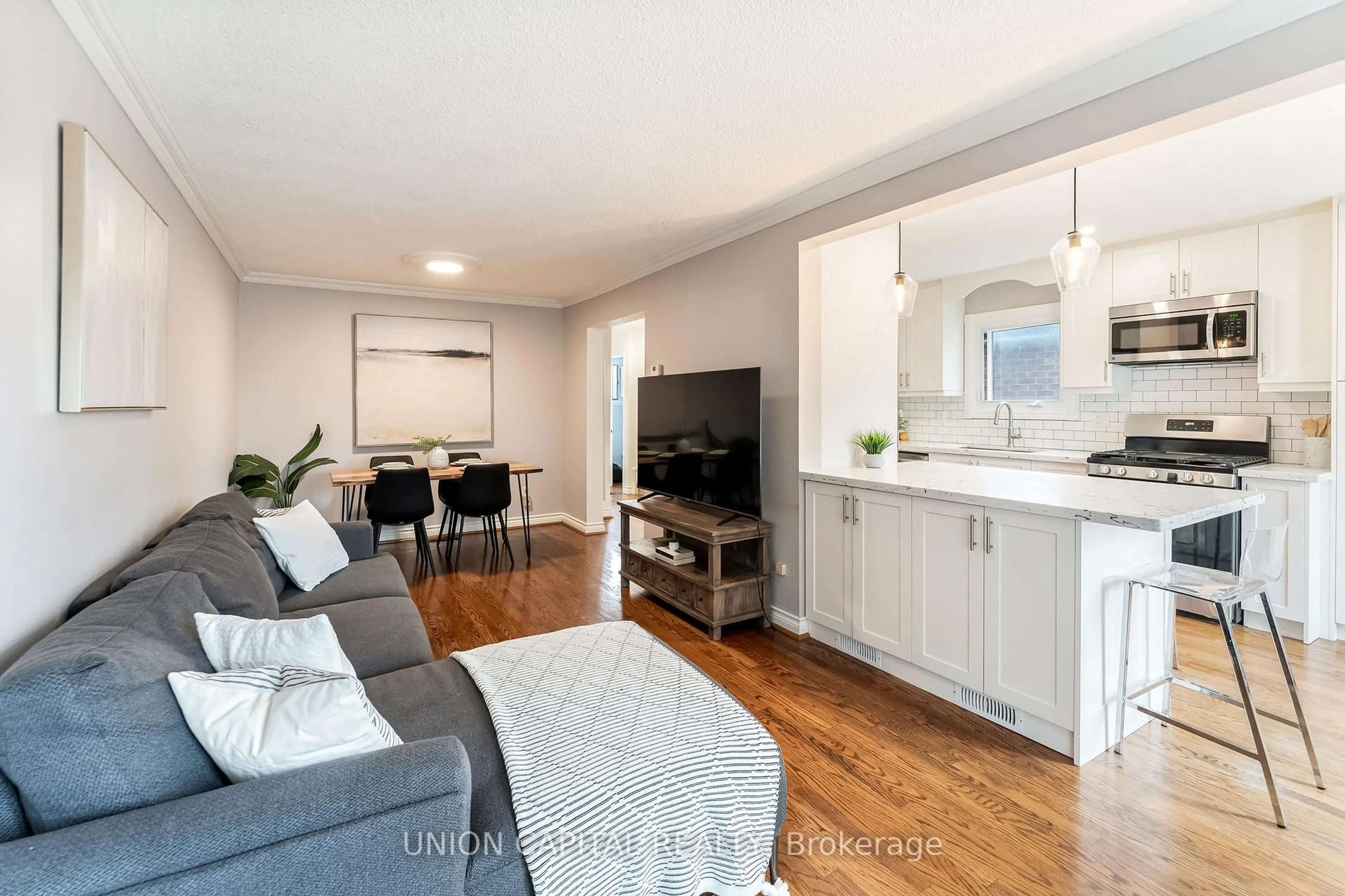 Living room with furniture, wood/laminate floor for 1167 Tanzer Crt, Pickering Ontario L1W 3S7