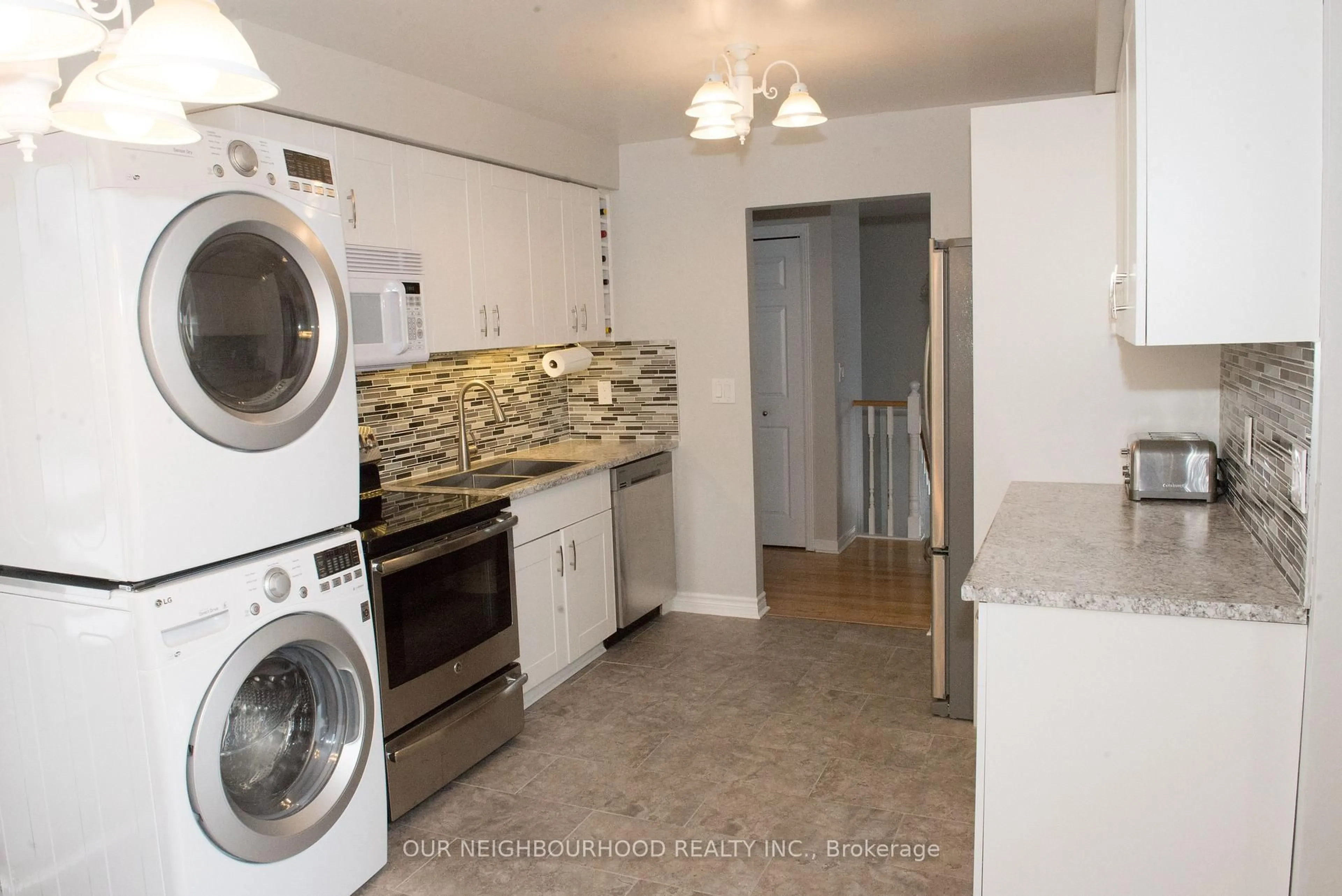Kitchen with laundary machines, unknown for 38 Centerfield Dr, Clarington Ontario L1E 1H4