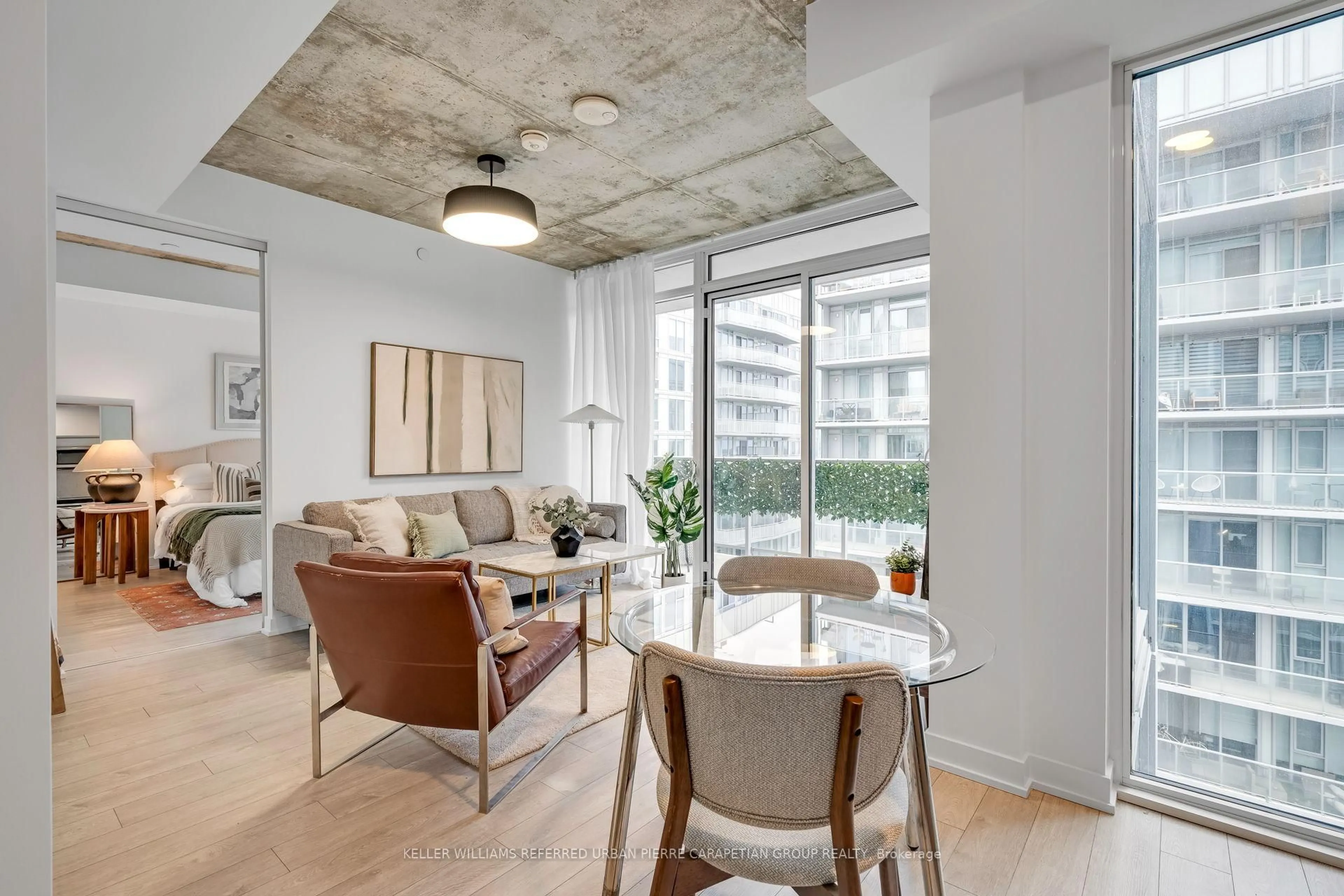 Living room with furniture, cement floor for 15 Baseball Pl #1002, Toronto Ontario M4M 2A5