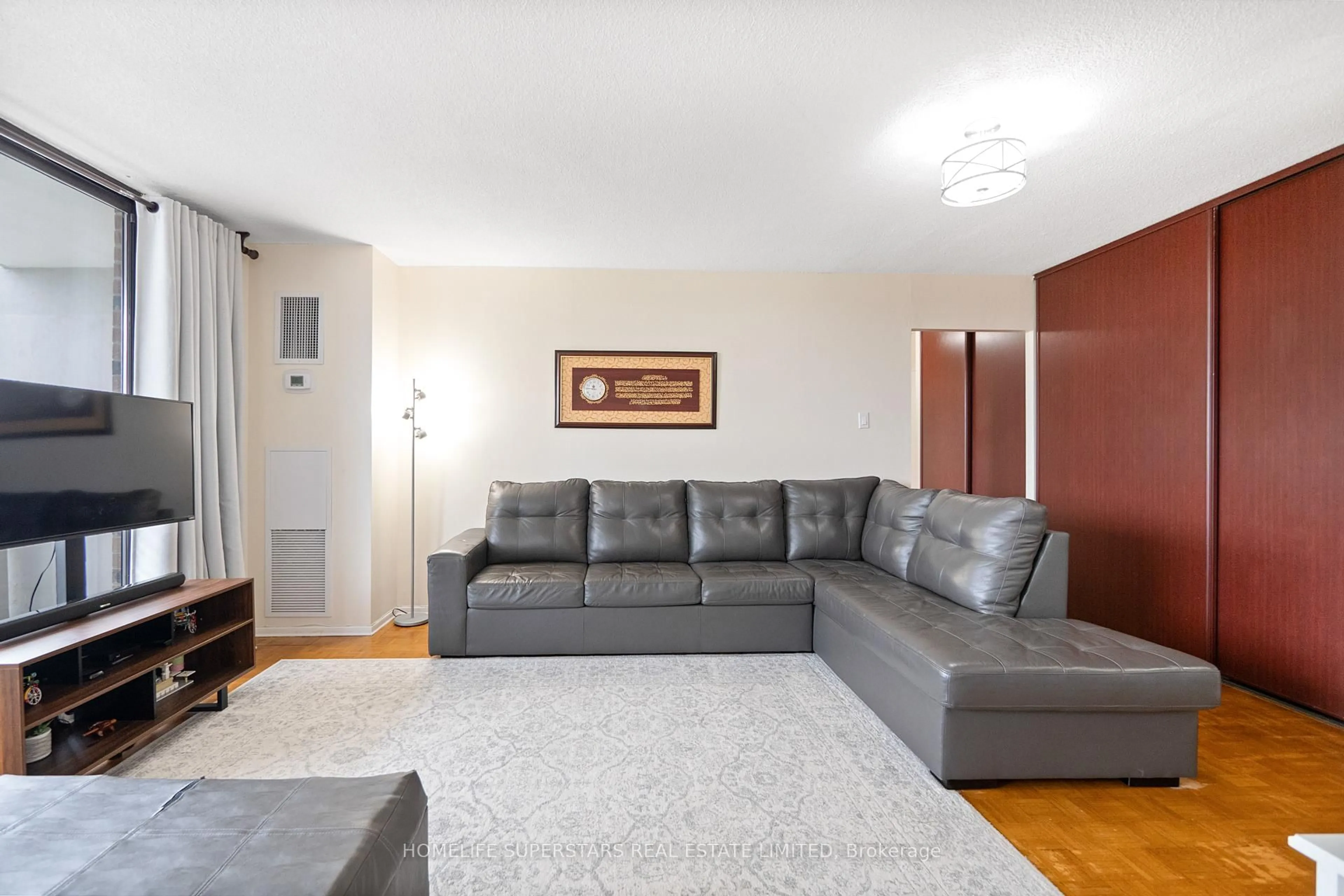 Living room with furniture, unknown for 301 Prudential Dr #409, Toronto Ontario M1P 4V3