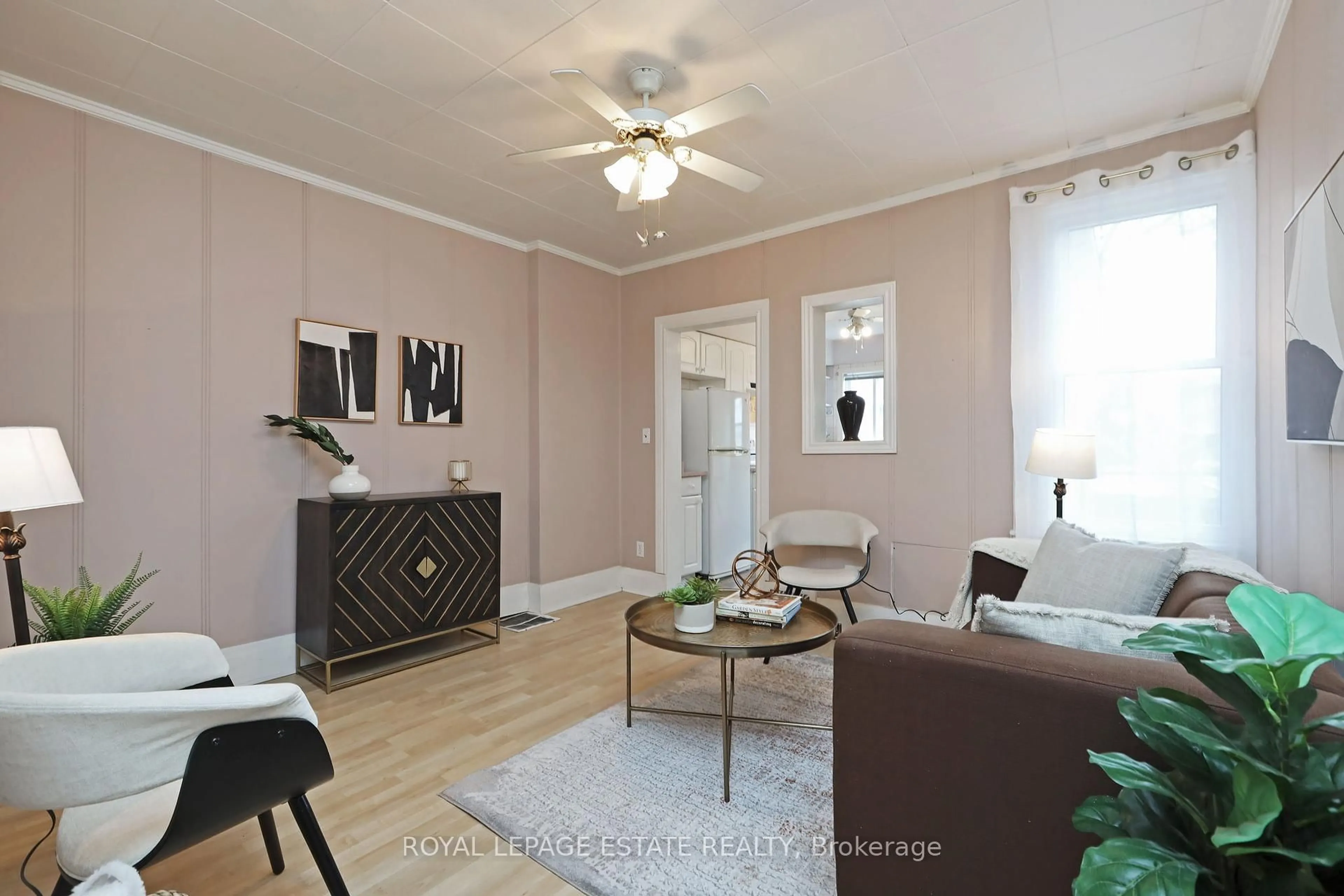 Living room with furniture, wood/laminate floor for 56 Balfour Ave, Toronto Ontario M4C 1T6