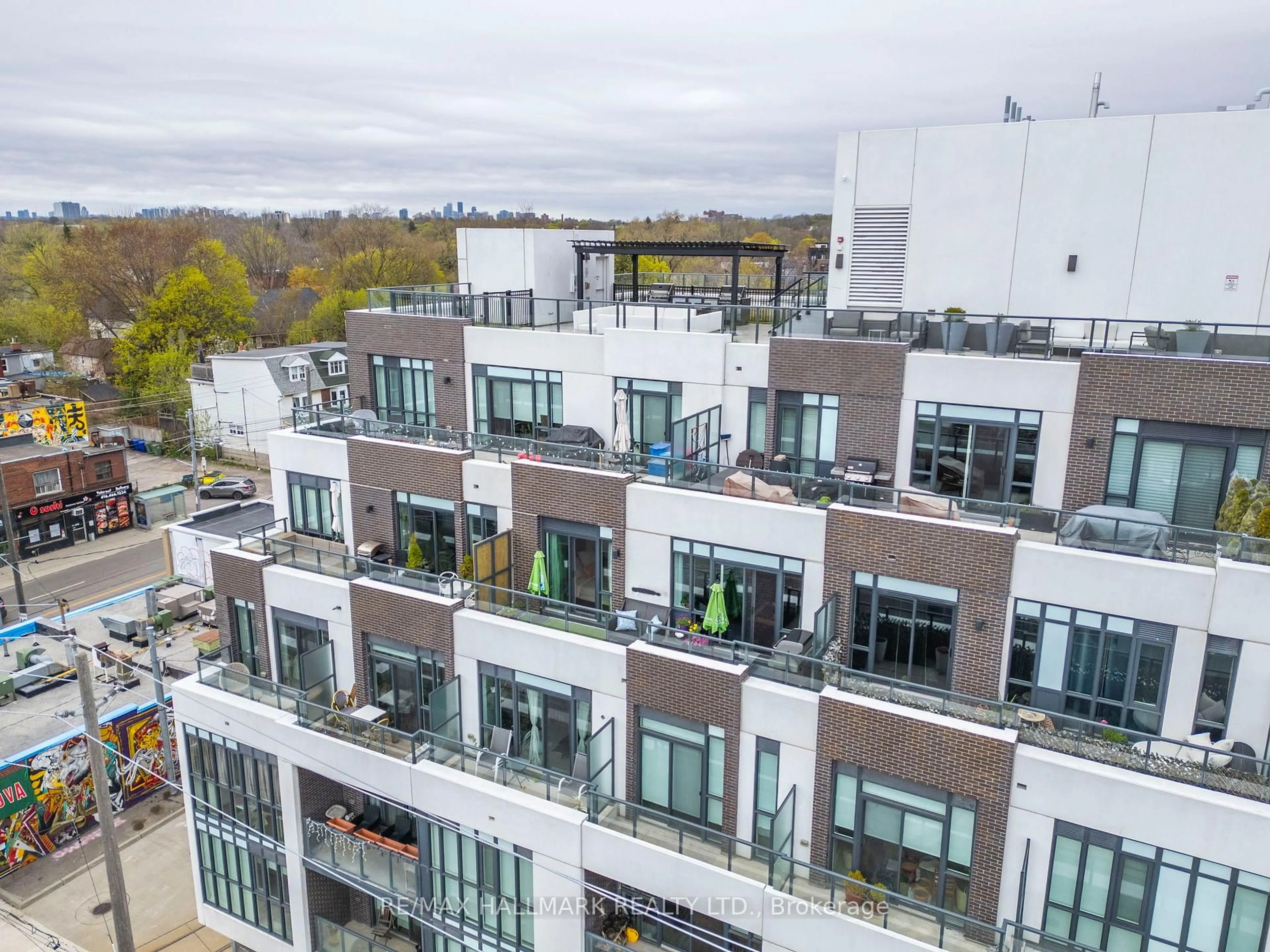 A pic from outside/outdoor area/front of a property/back of a property/a pic from drone, city buildings view from balcony for 1630 Queen St #507, Toronto Ontario M4L 0B3