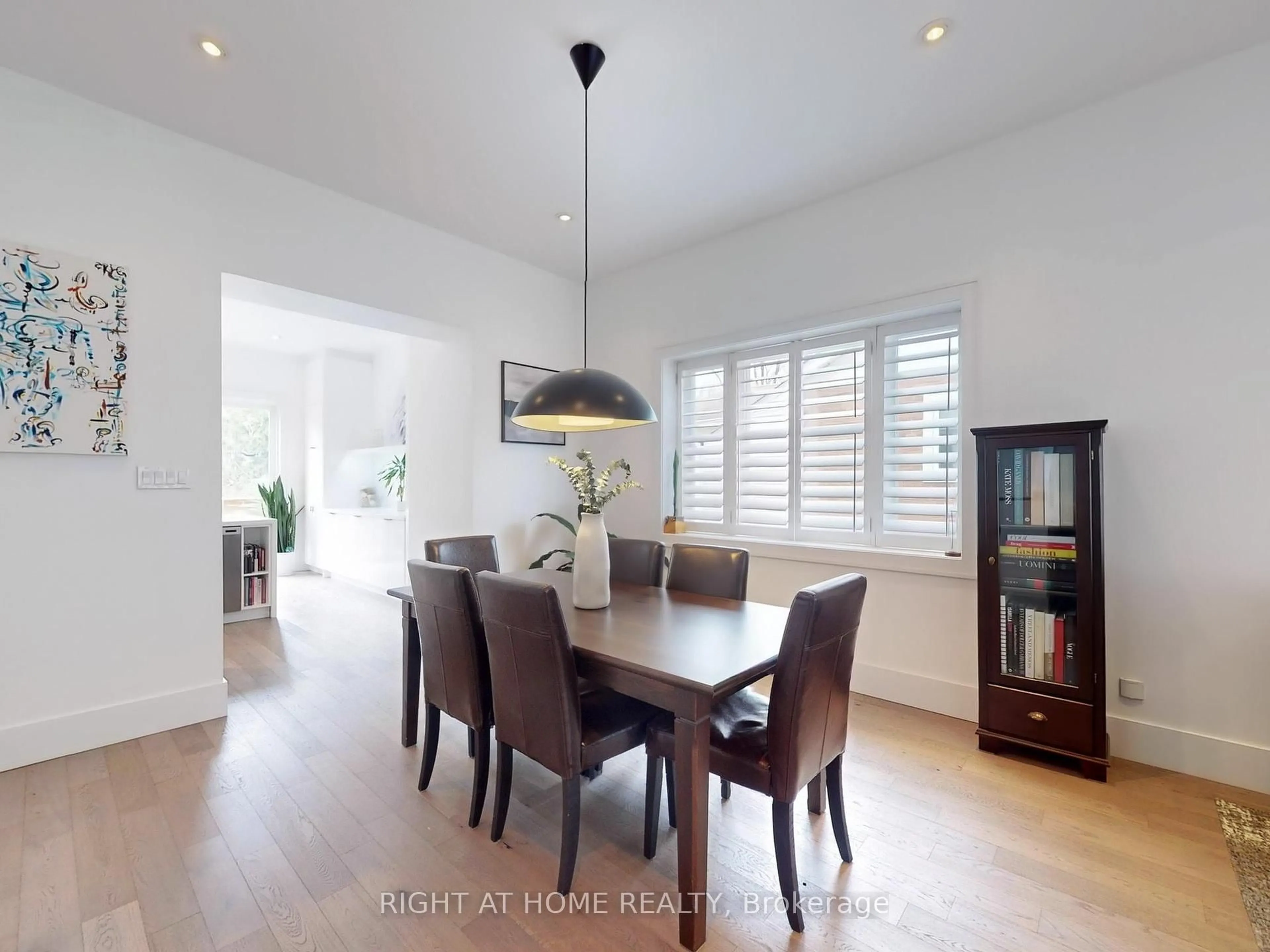 Dining room, wood/laminate floor for 77 Leroy Ave, Toronto Ontario M4J 4G9