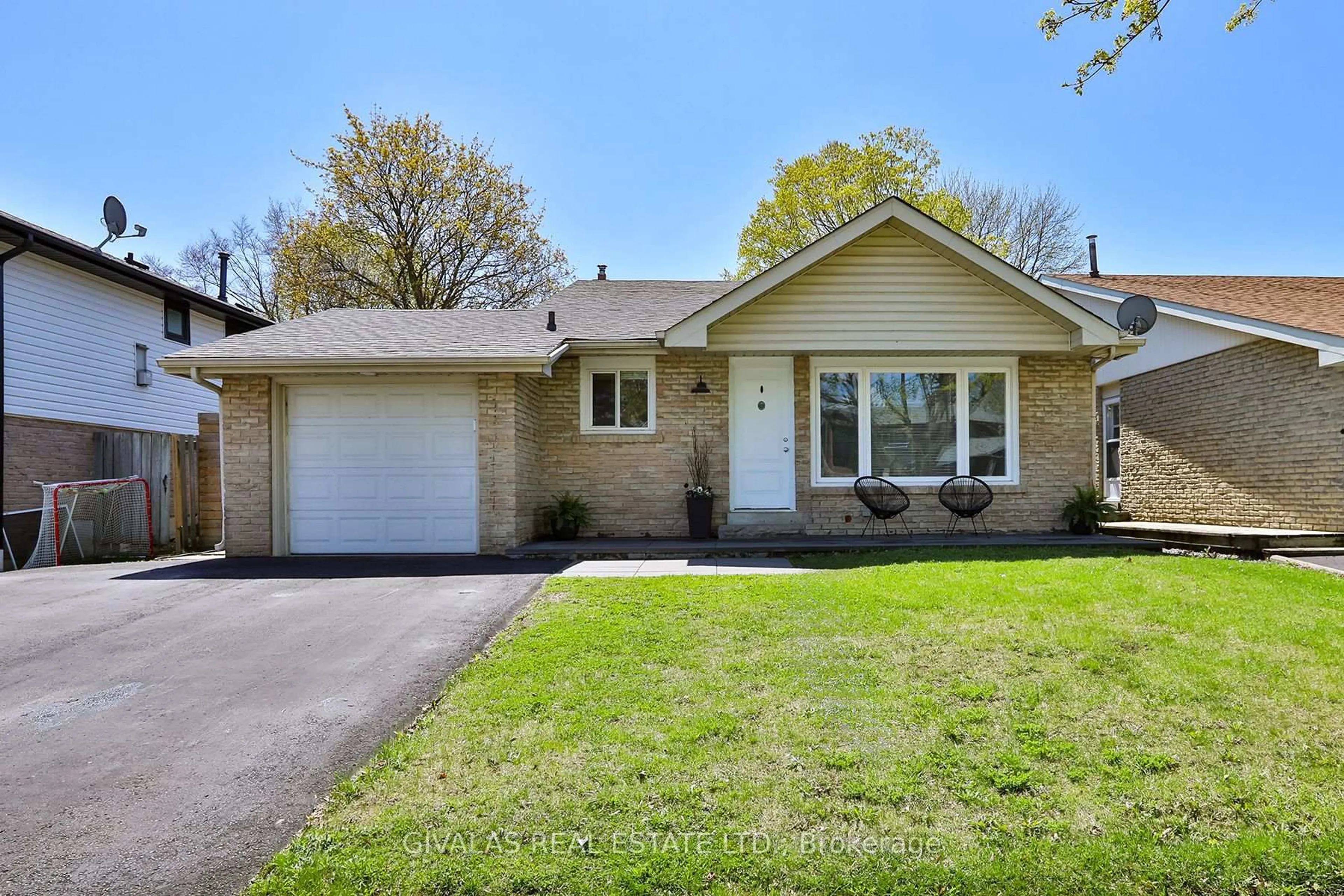 Home with brick exterior material, street for 574 Bradley Dr, Whitby Ontario L1N 6C2