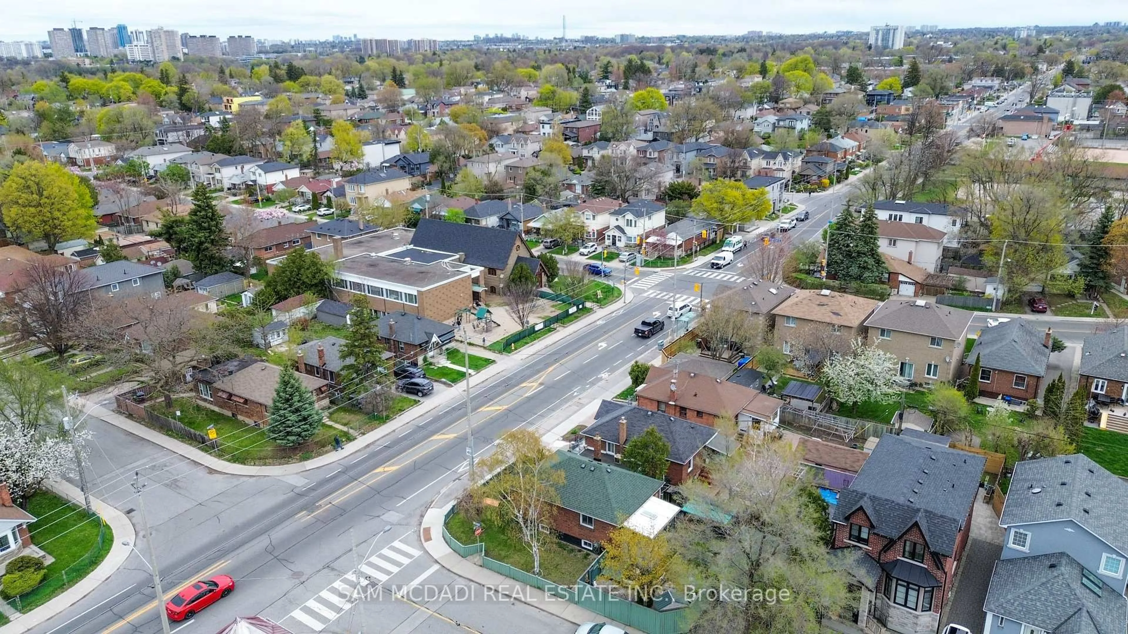 A pic from outside/outdoor area/front of a property/back of a property/a pic from drone, street for 319 Cosburn Ave, Toronto Ontario M4J 2N1