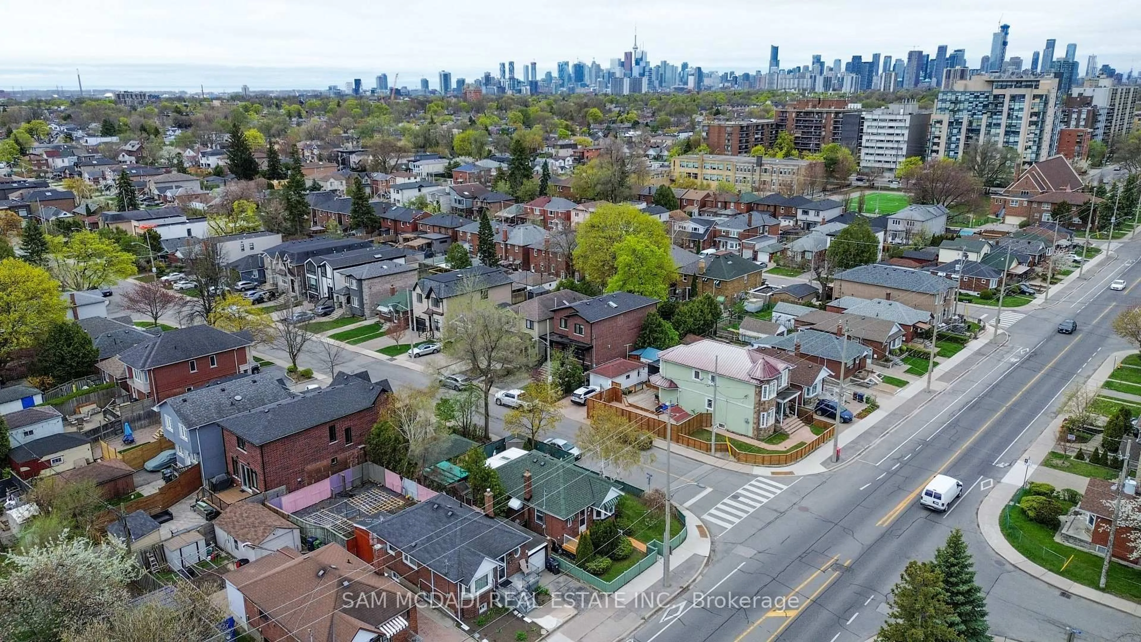 A pic from outside/outdoor area/front of a property/back of a property/a pic from drone, street for 319 Cosburn Ave, Toronto Ontario M4J 2N1