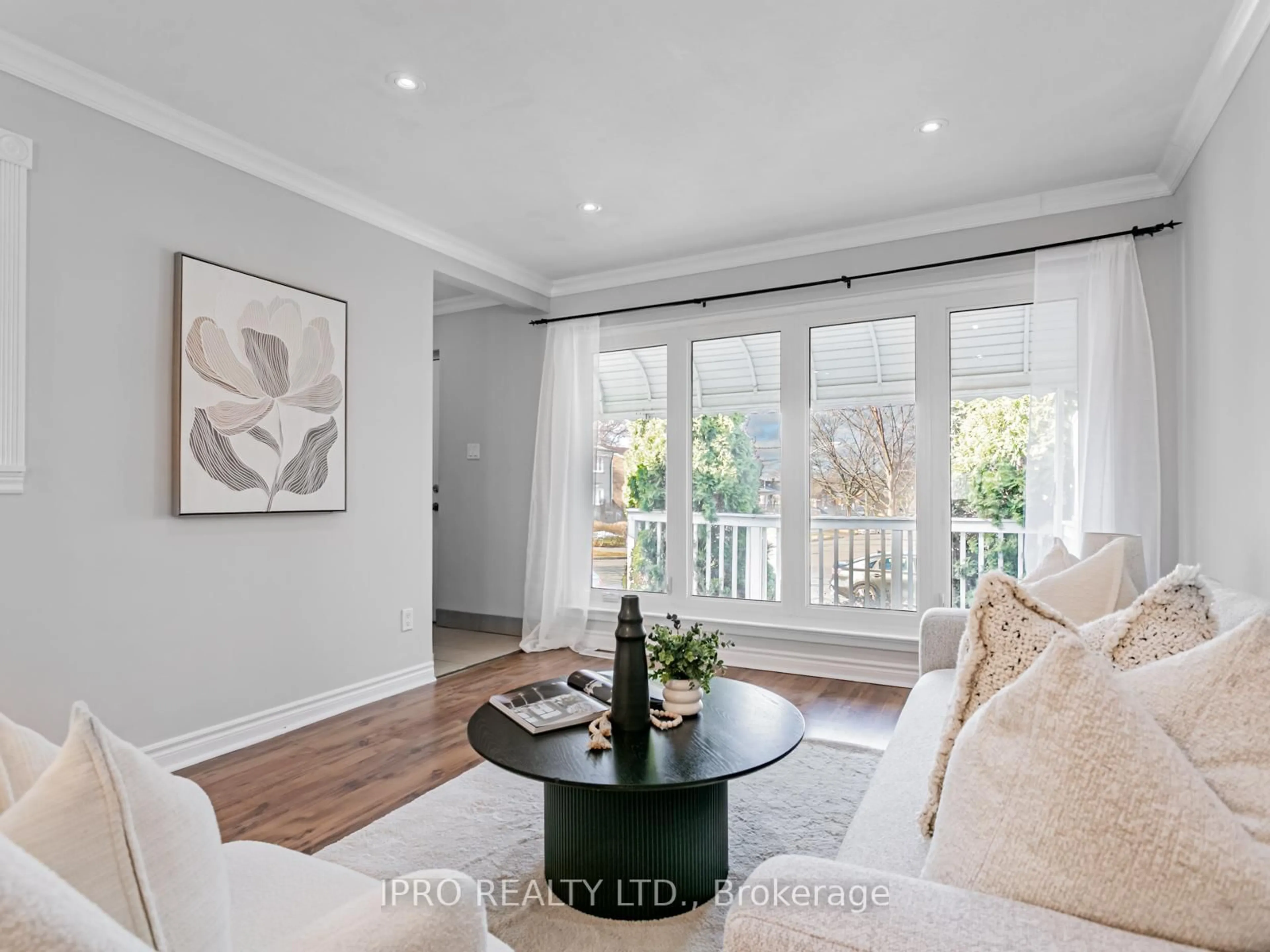 Living room with furniture, wood/laminate floor for 67 Trinnell Blvd, Toronto Ontario M1L 1S6