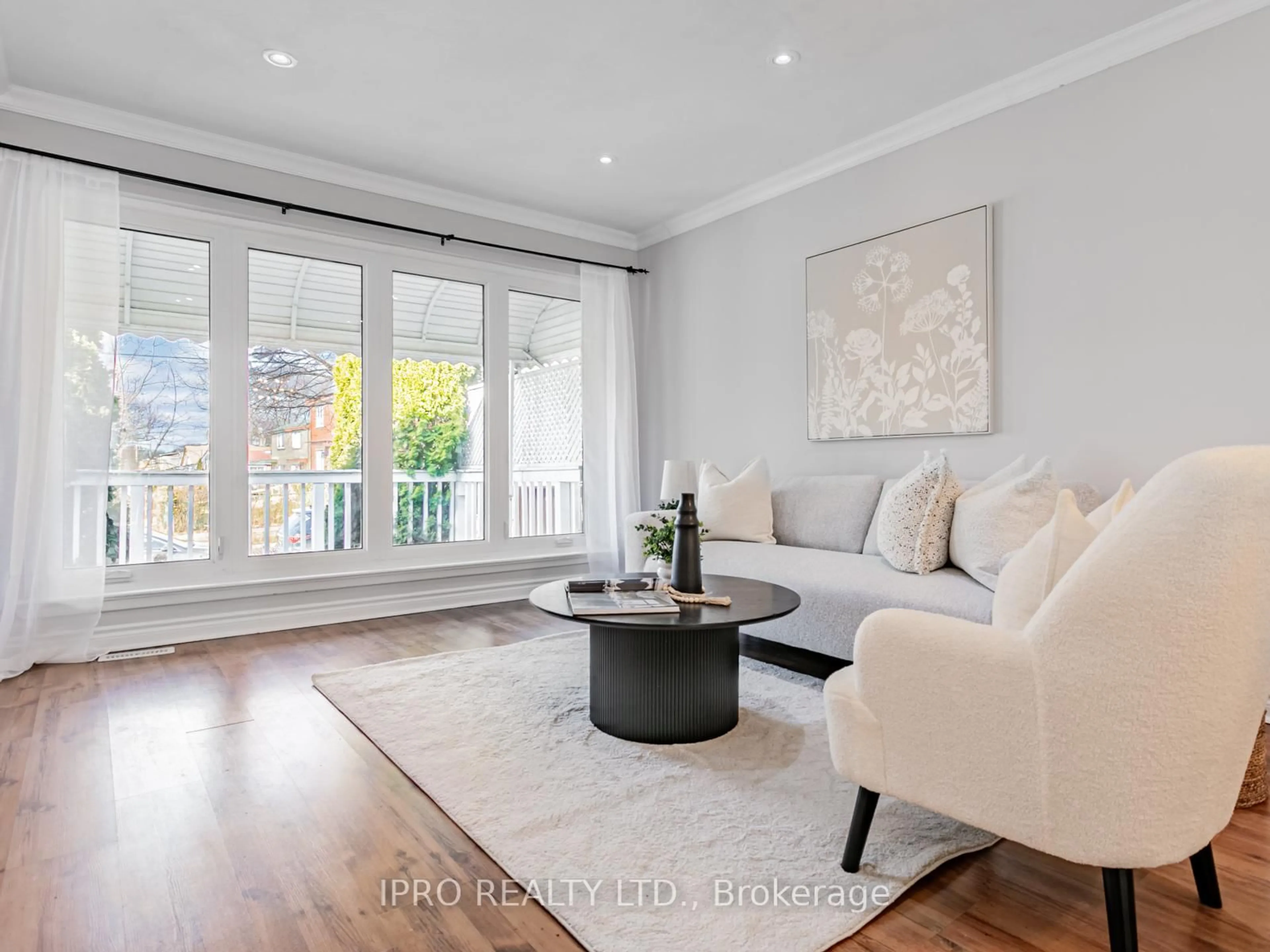 Living room with furniture, wood/laminate floor for 67 Trinnell Blvd, Toronto Ontario M1L 1S6