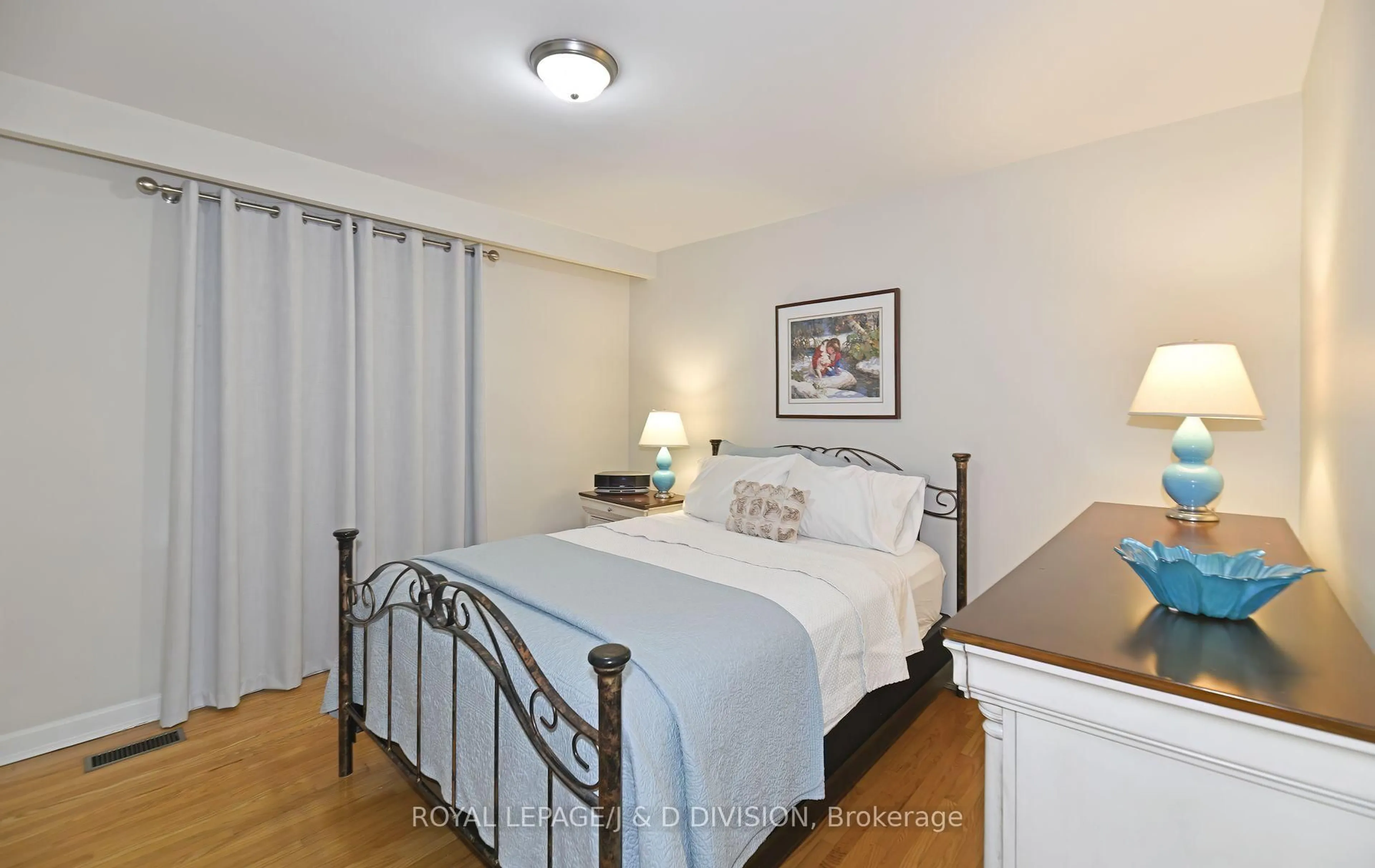 Bedroom with bed, wood/laminate floor for 19 Brian Ave, Toronto Ontario M1R 3J1