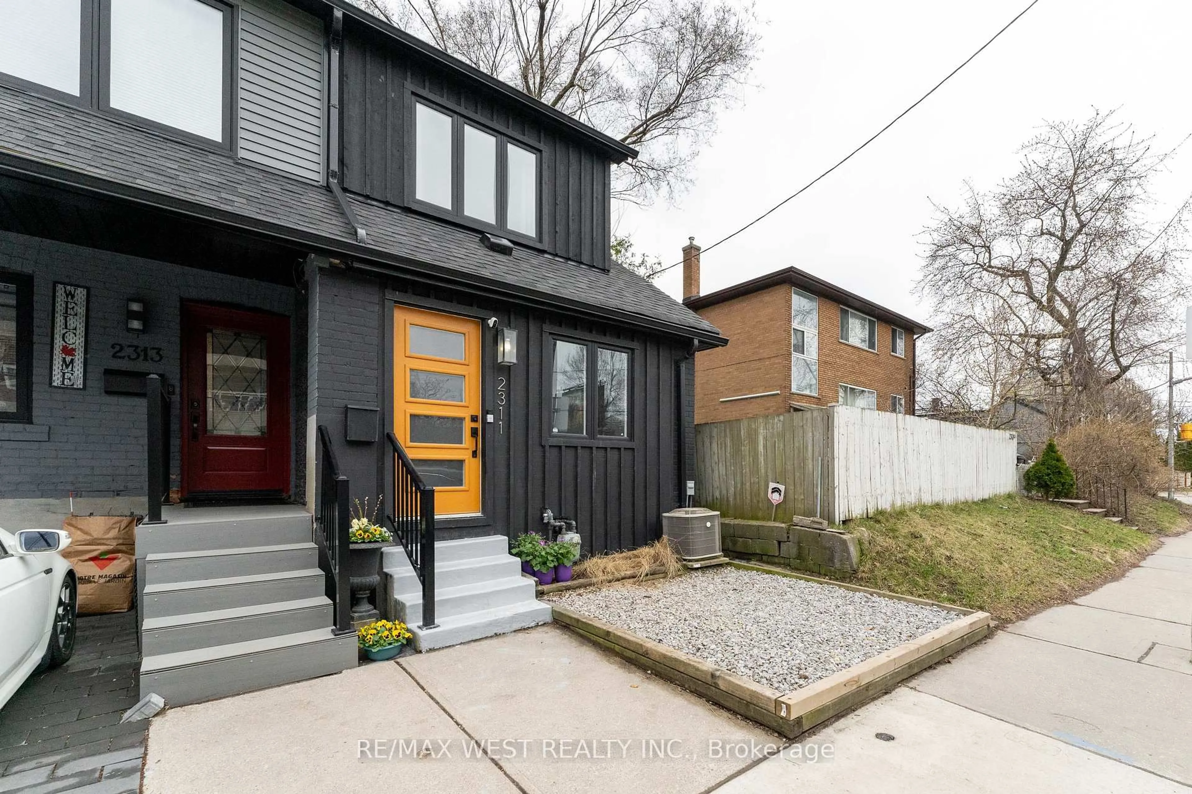 Home with brick exterior material, street for 2311 Gerrard St, Toronto Ontario M4E 2E5
