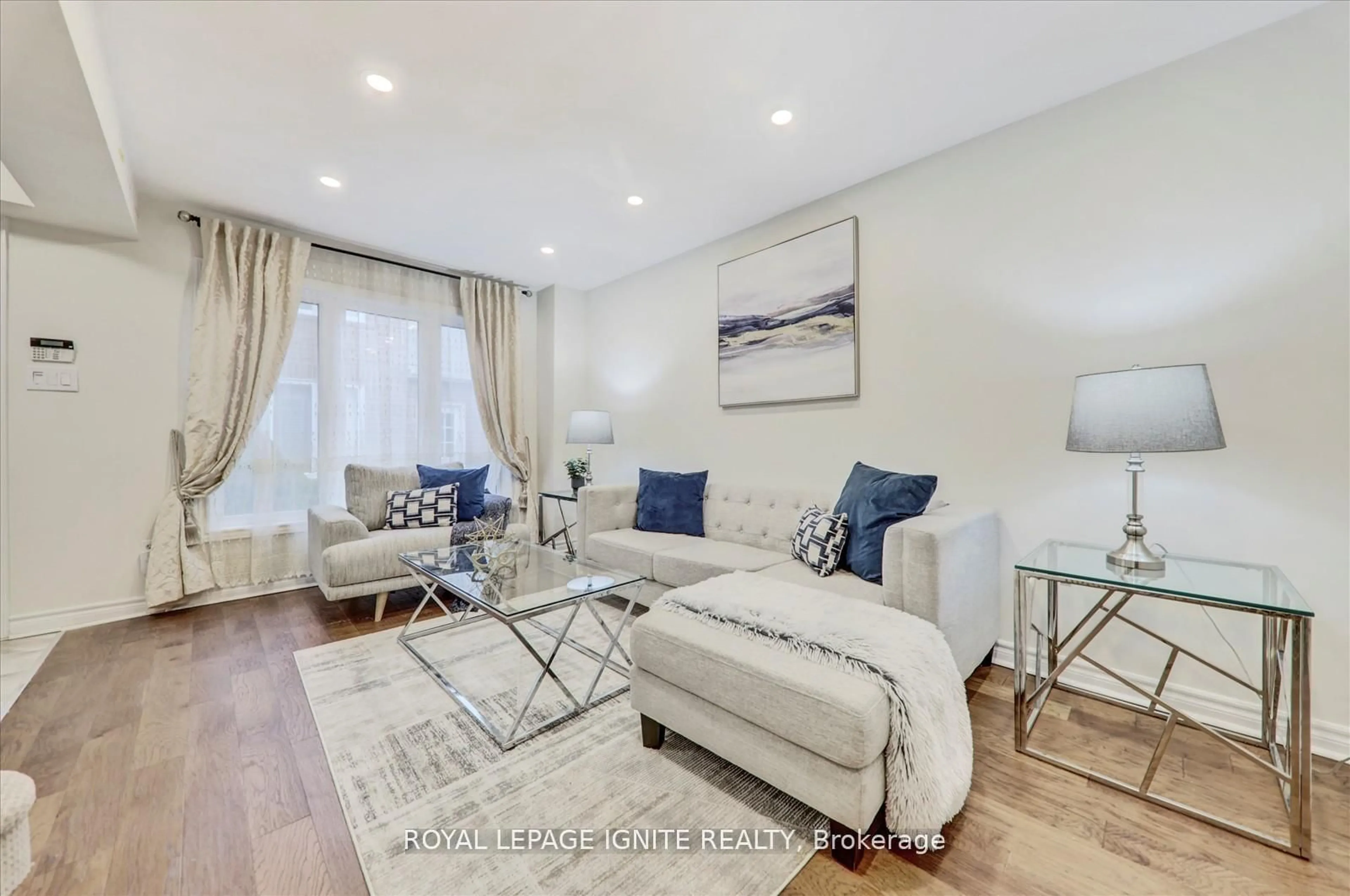 Living room with furniture, wood/laminate floor for 39 Maberley Cres, Toronto Ontario M1C 3K7