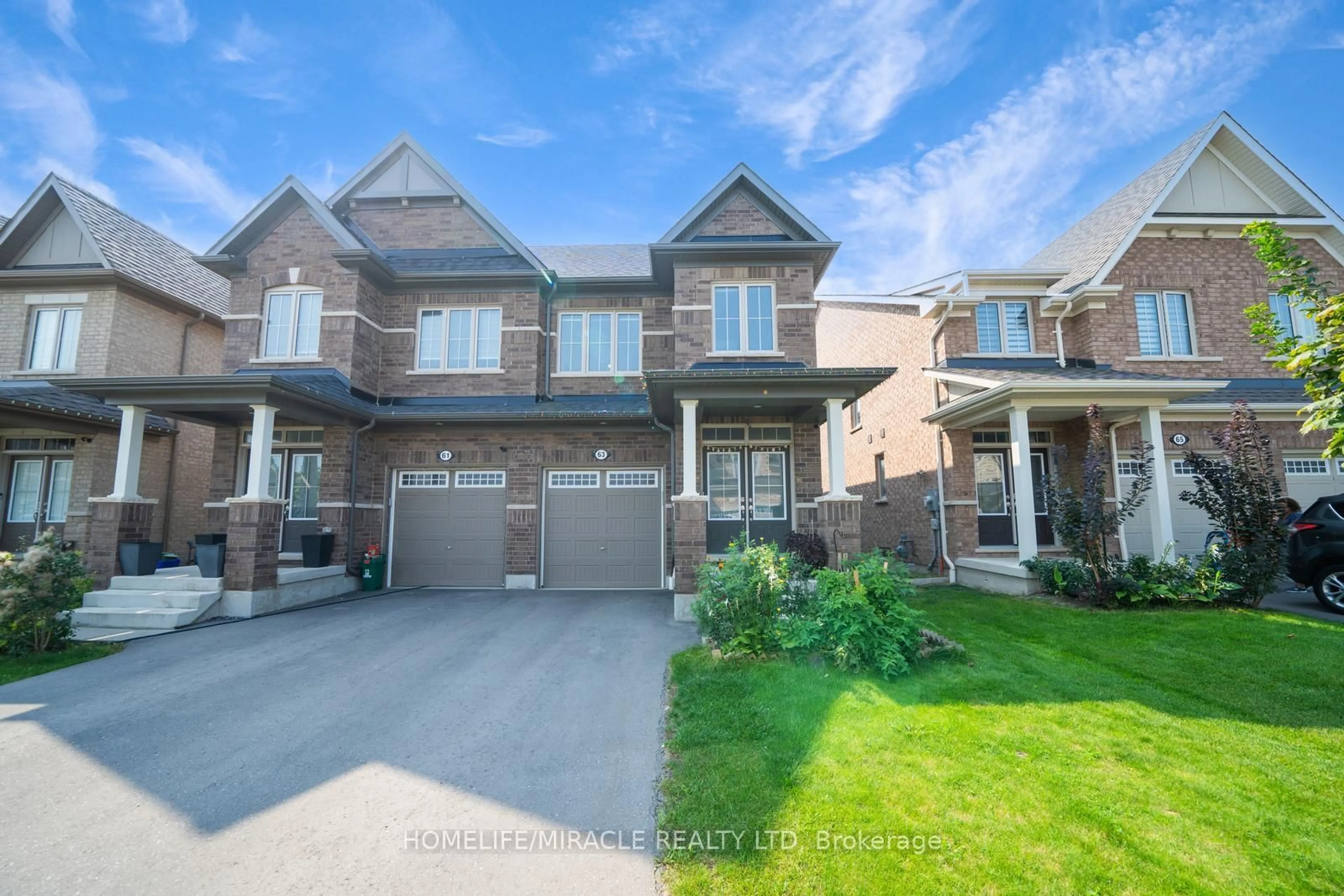 Home with brick exterior material, street for 63 Auckland Dr, Whitby Ontario L1P 0H4