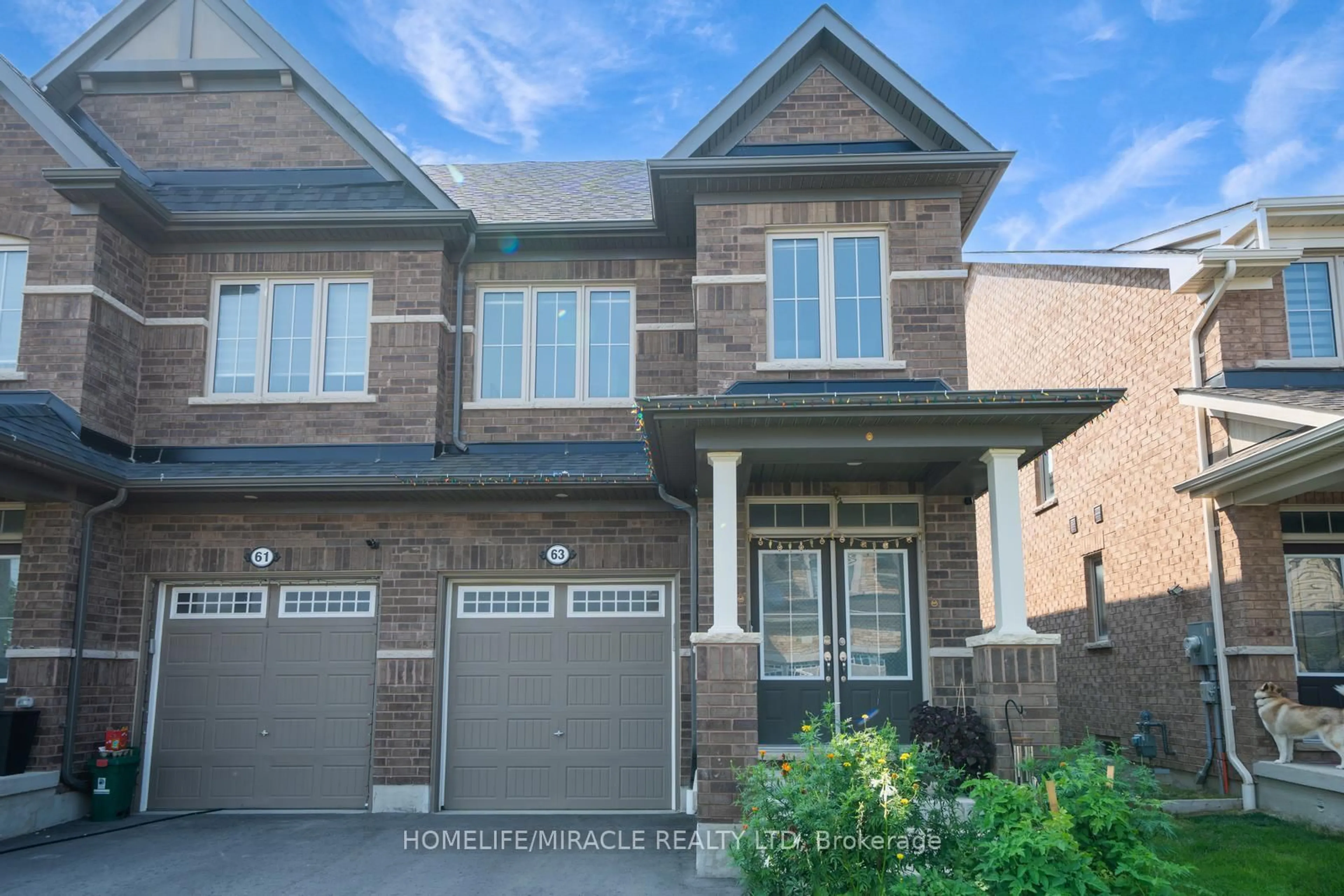 Home with brick exterior material, street for 63 Auckland Dr, Whitby Ontario L1P 0H4