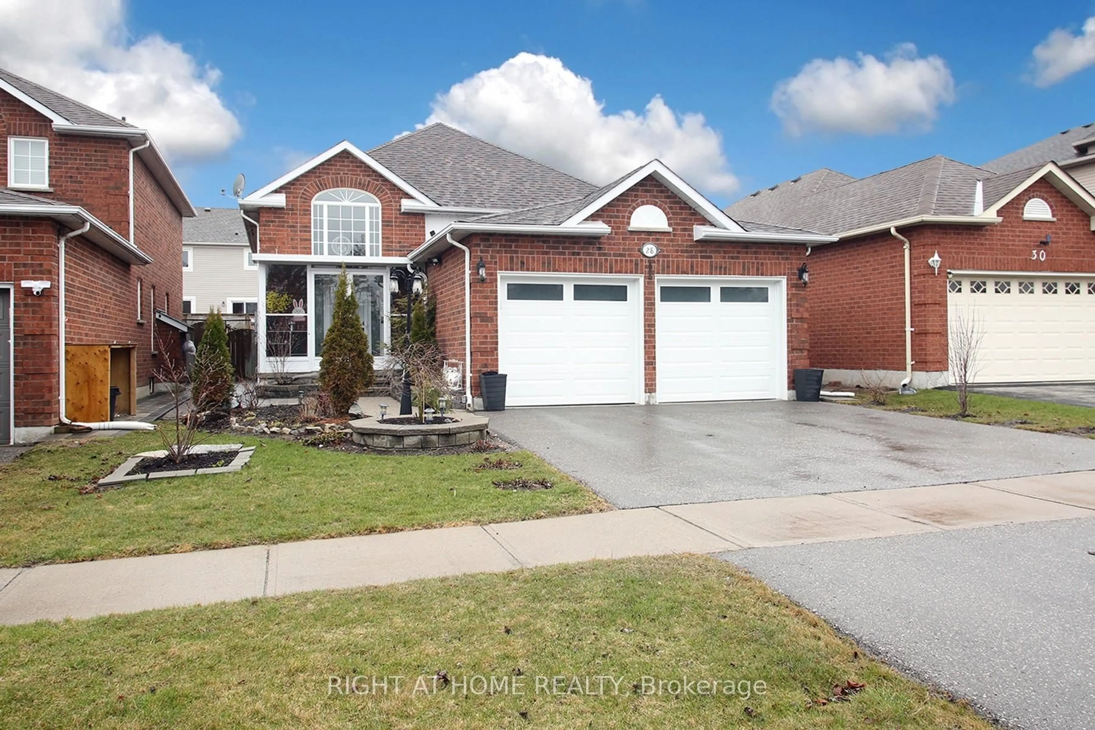 Home with brick exterior material, street for 28 West Side Dr, Clarington Ontario L1C 4Y8