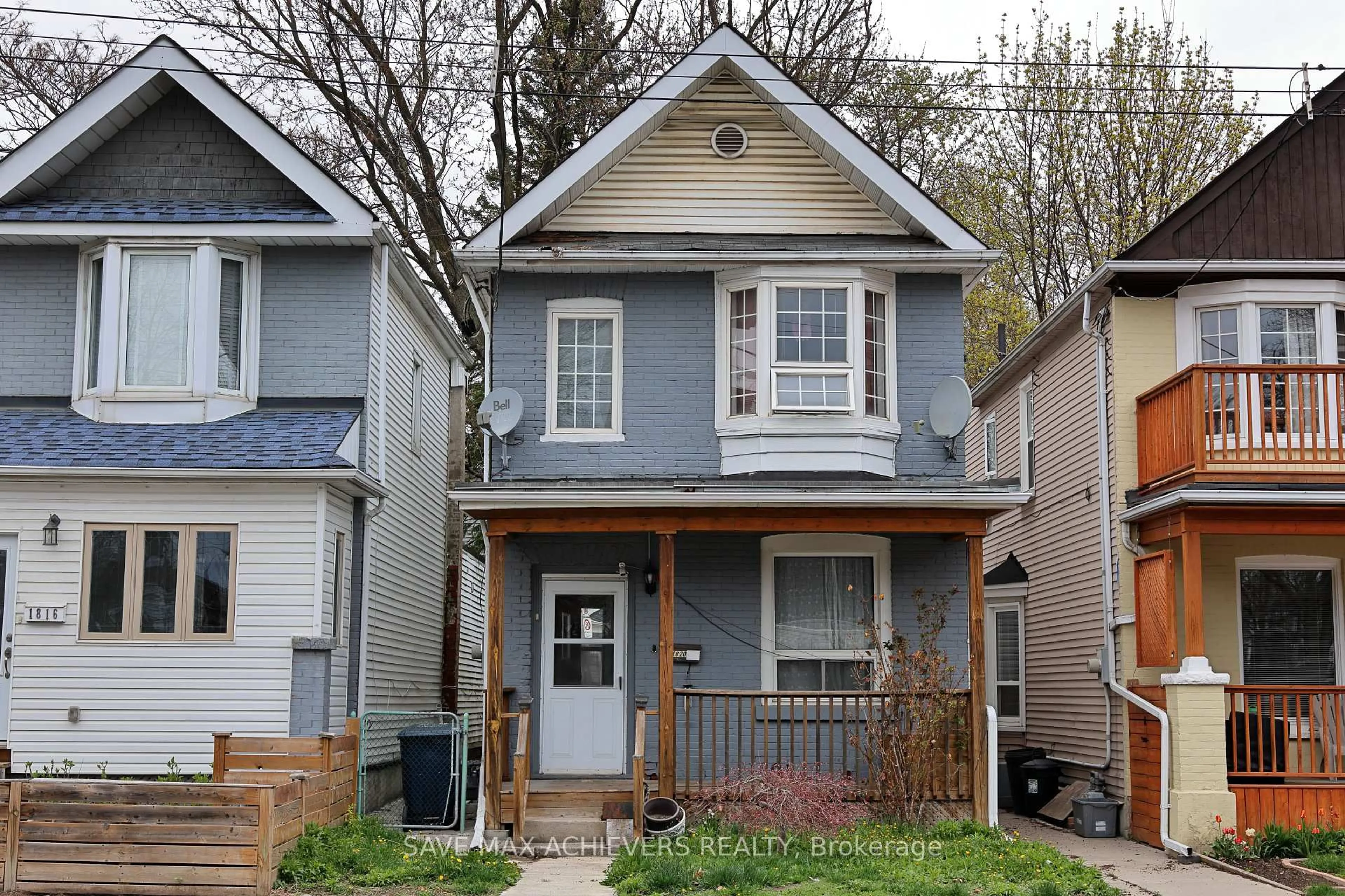 Home with vinyl exterior material, street for 1820 Dundas St, Toronto Ontario M4L 1M5