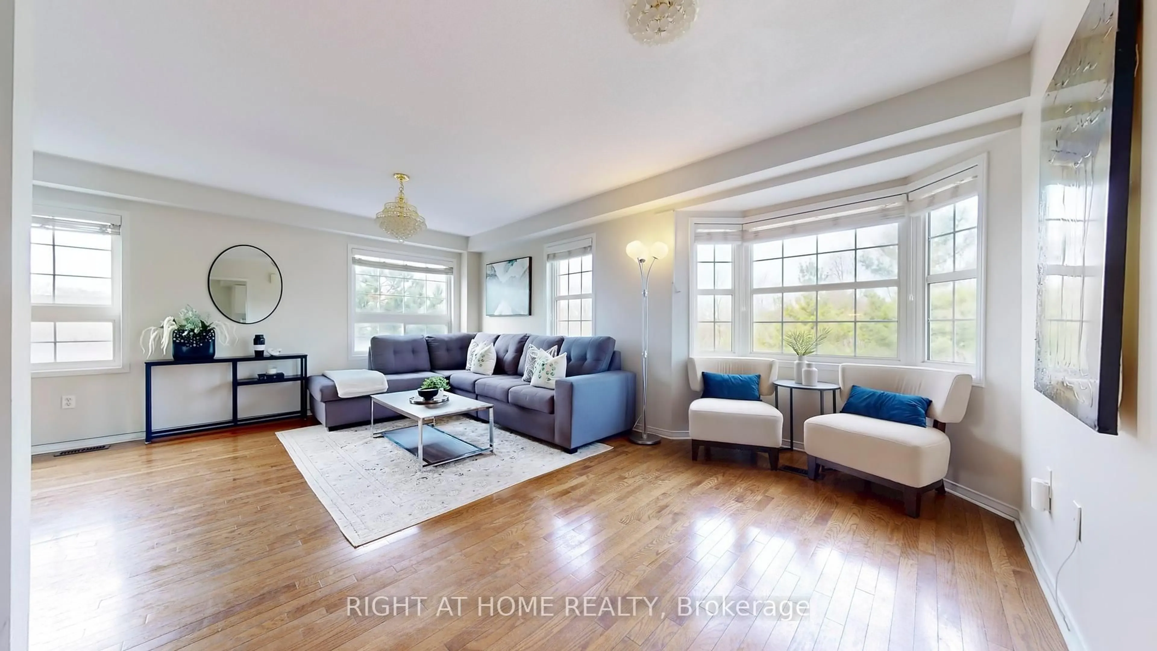 Living room with furniture, wood/laminate floor for 46 Huxtable Lane, Toronto Ontario M1B 0A3