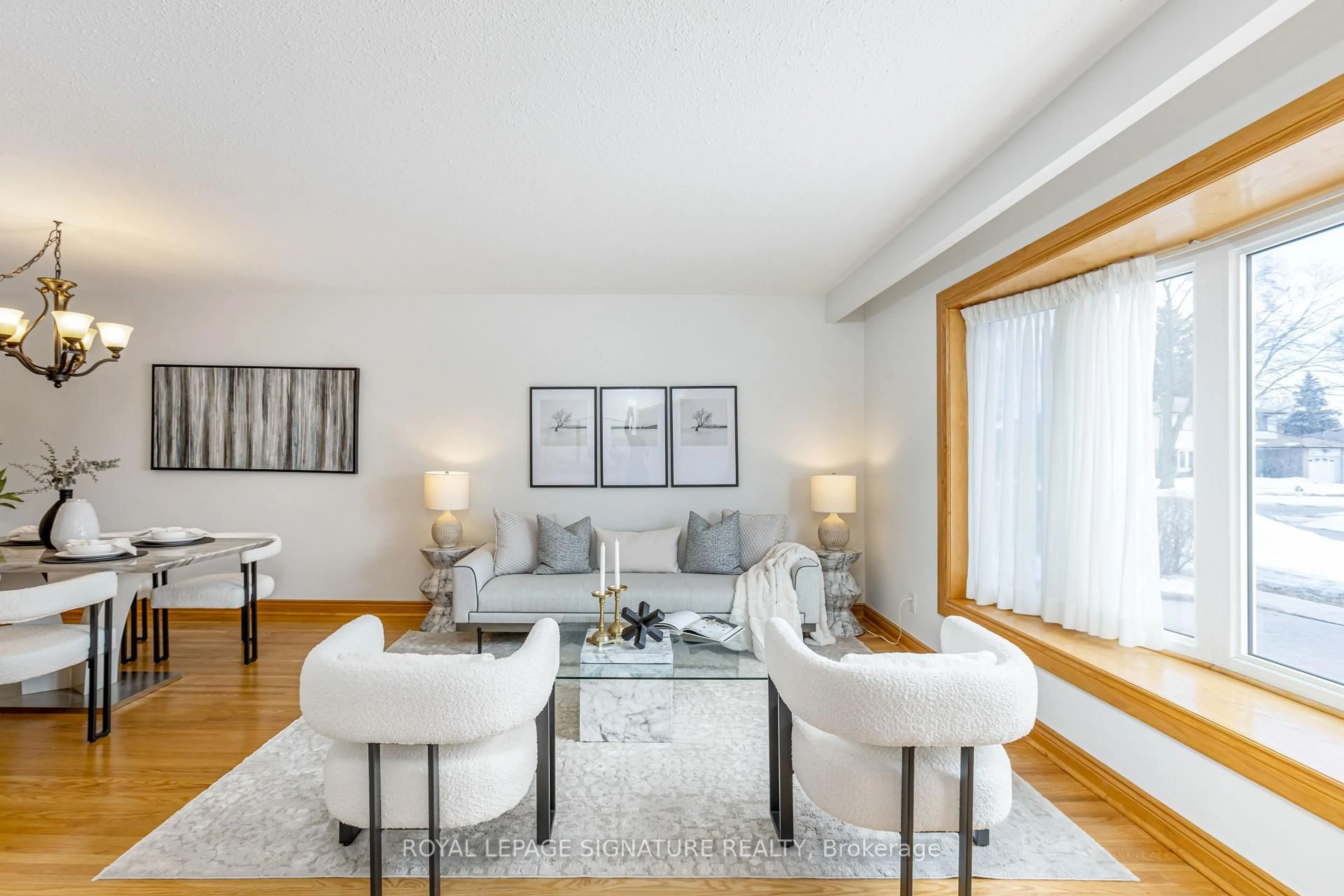 Living room with furniture, wood/laminate floor for 40 Tweedrock Cres, Toronto Ontario M1E 4L5