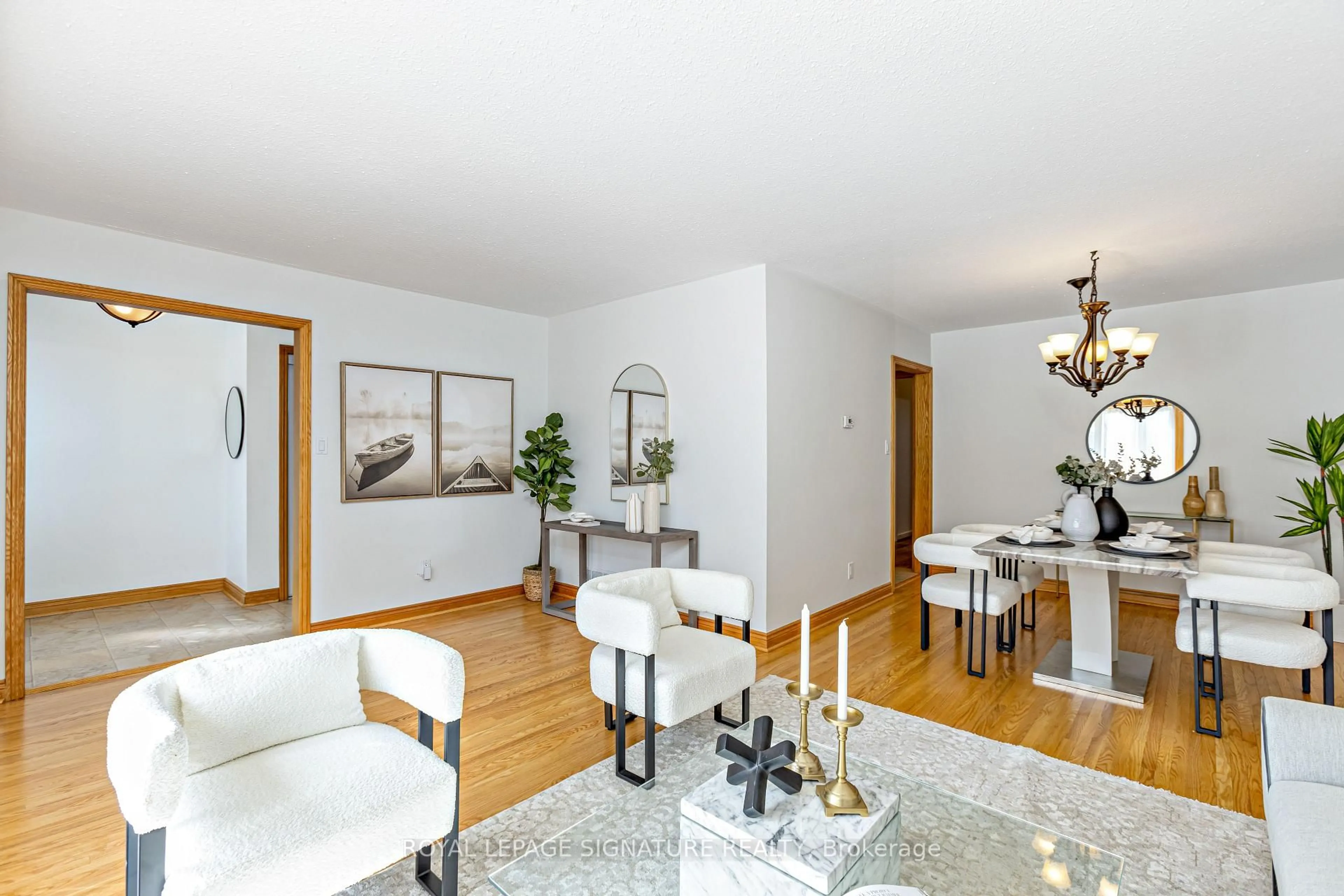 Living room with furniture, wood/laminate floor for 40 Tweedrock Cres, Toronto Ontario M1E 4L5