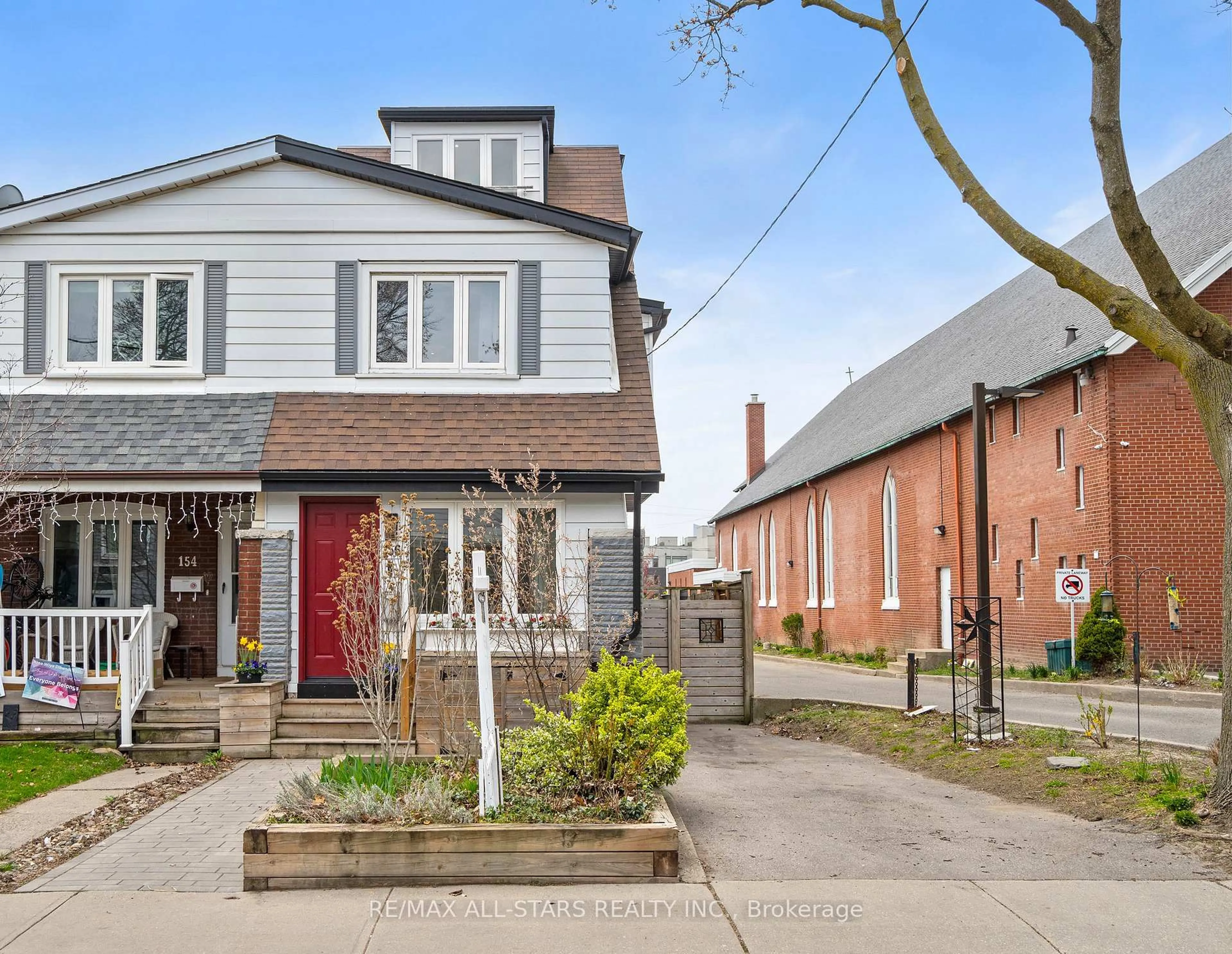 Home with brick exterior material, street for 156 Leslie St, Toronto Ontario M4M 3C7