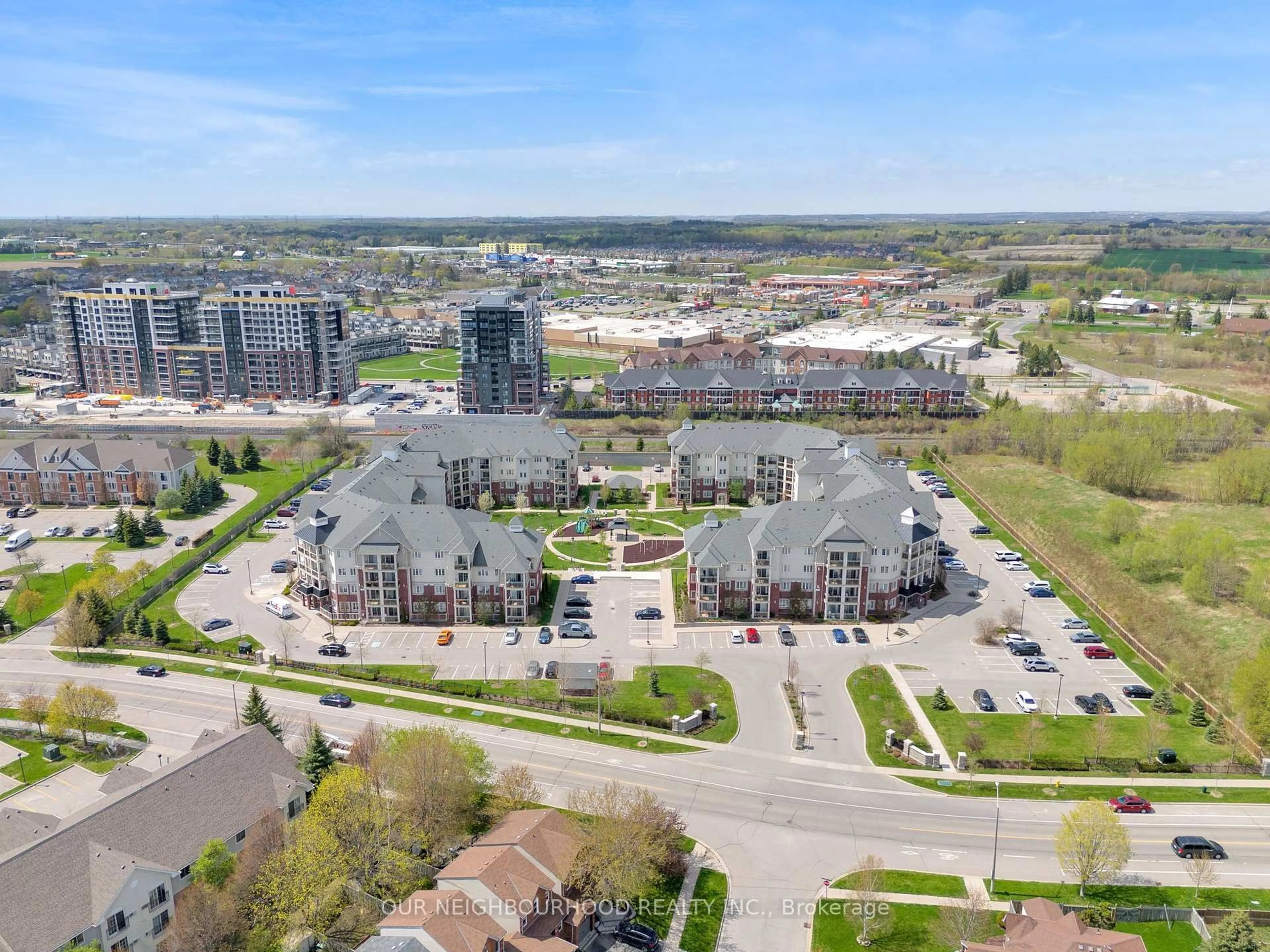 A pic from outside/outdoor area/front of a property/back of a property/a pic from drone, city buildings view from balcony for 80 Aspen Springs Dr #207, Clarington Ontario L1C 0V4