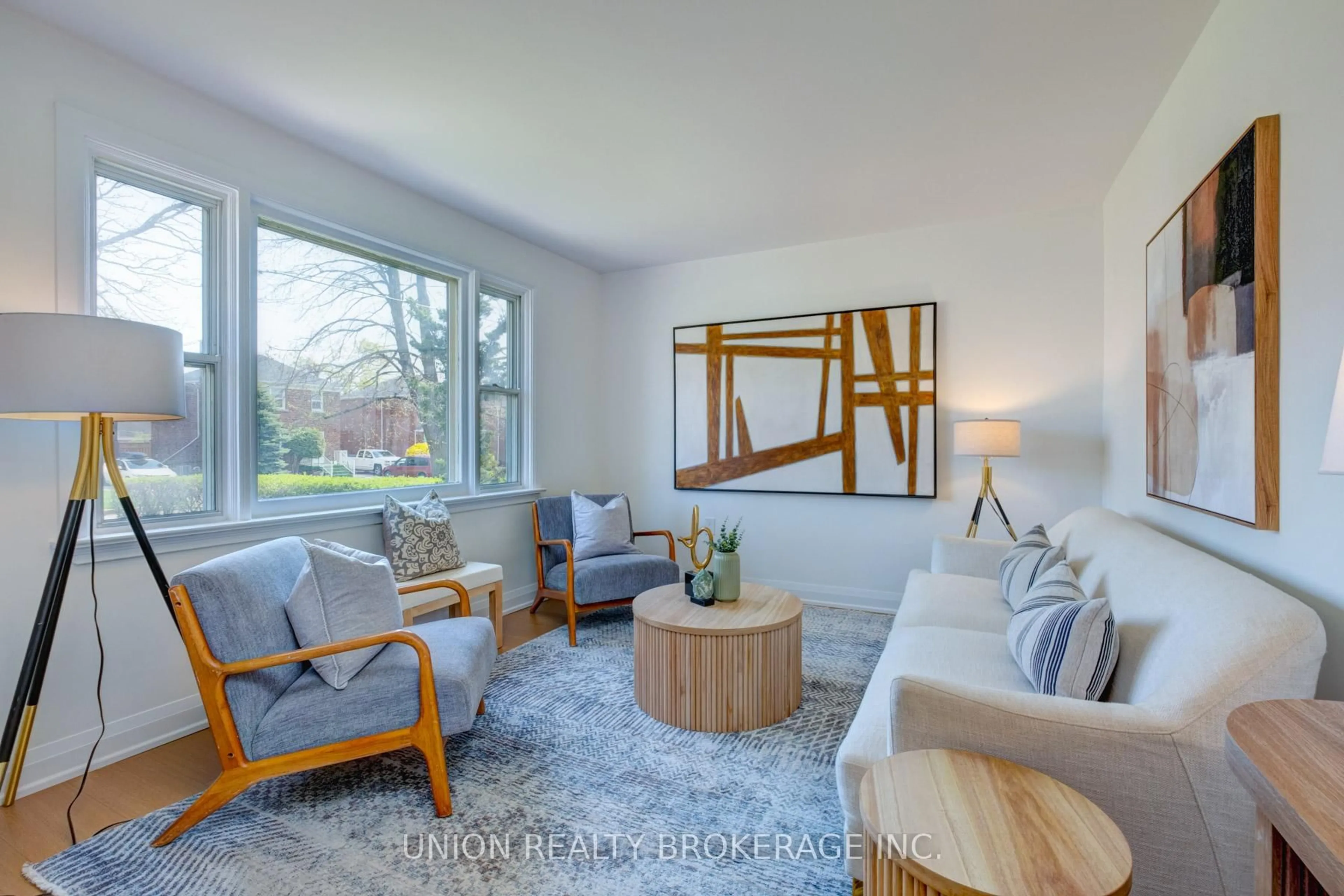 Living room with furniture, wood/laminate floor for 40 Stamford Sq, Toronto Ontario M1L 1X6