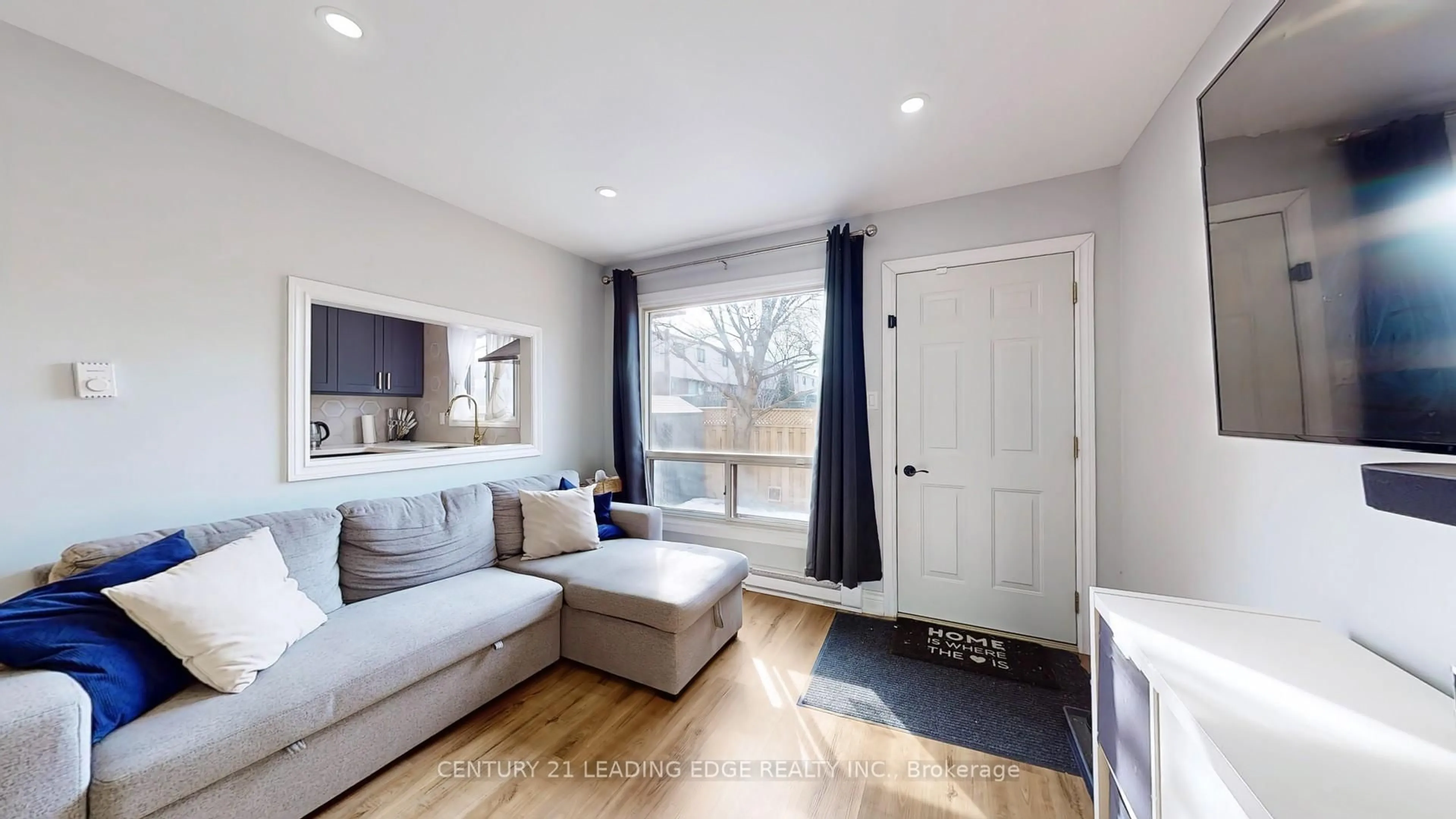 Living room with furniture, wood/laminate floor for 1100 Oxford St #118, Oshawa Ontario L1J 6G4