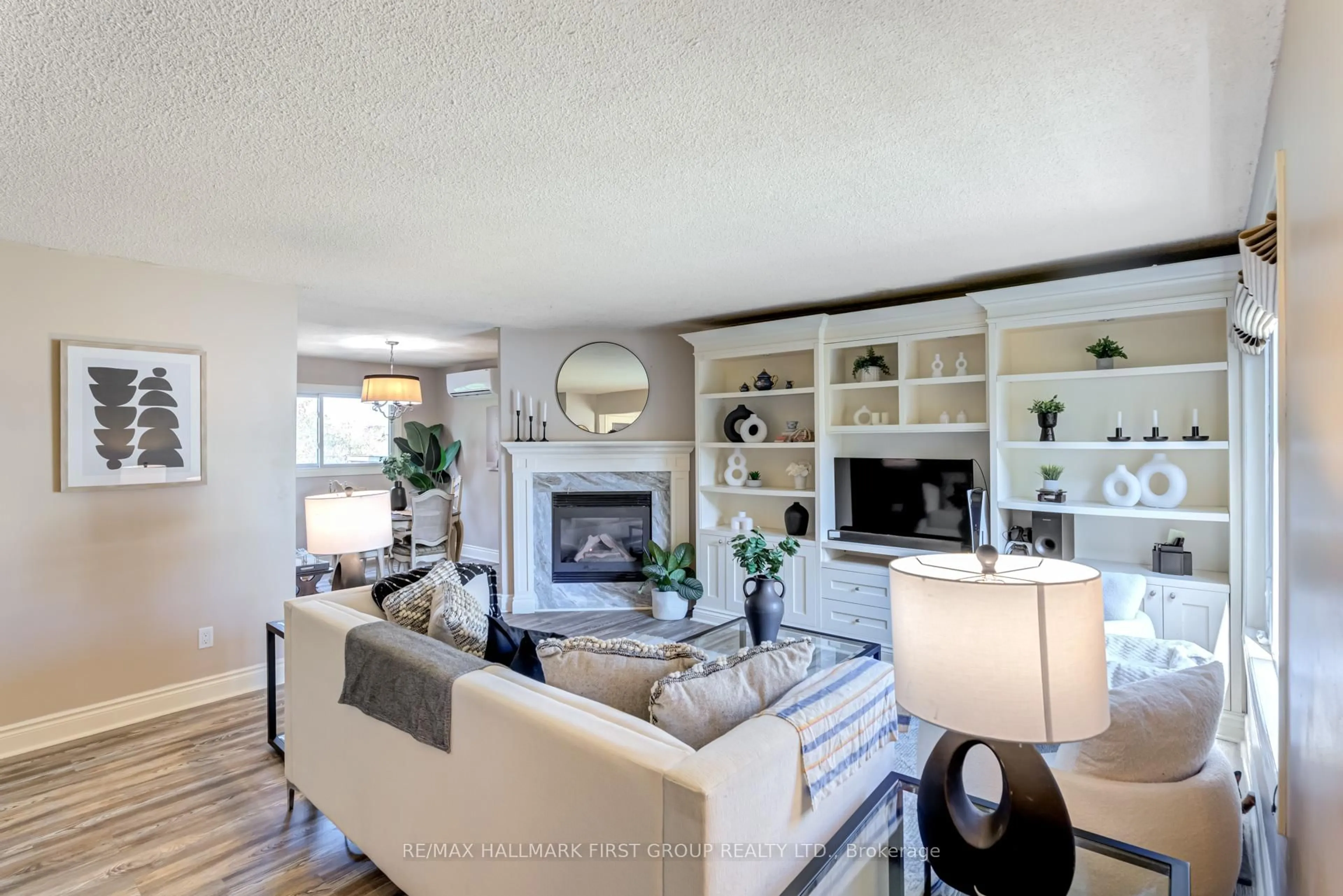 Living room with furniture, wood/laminate floor for 1366 Brands Crt, Pickering Ontario L1V 2V4